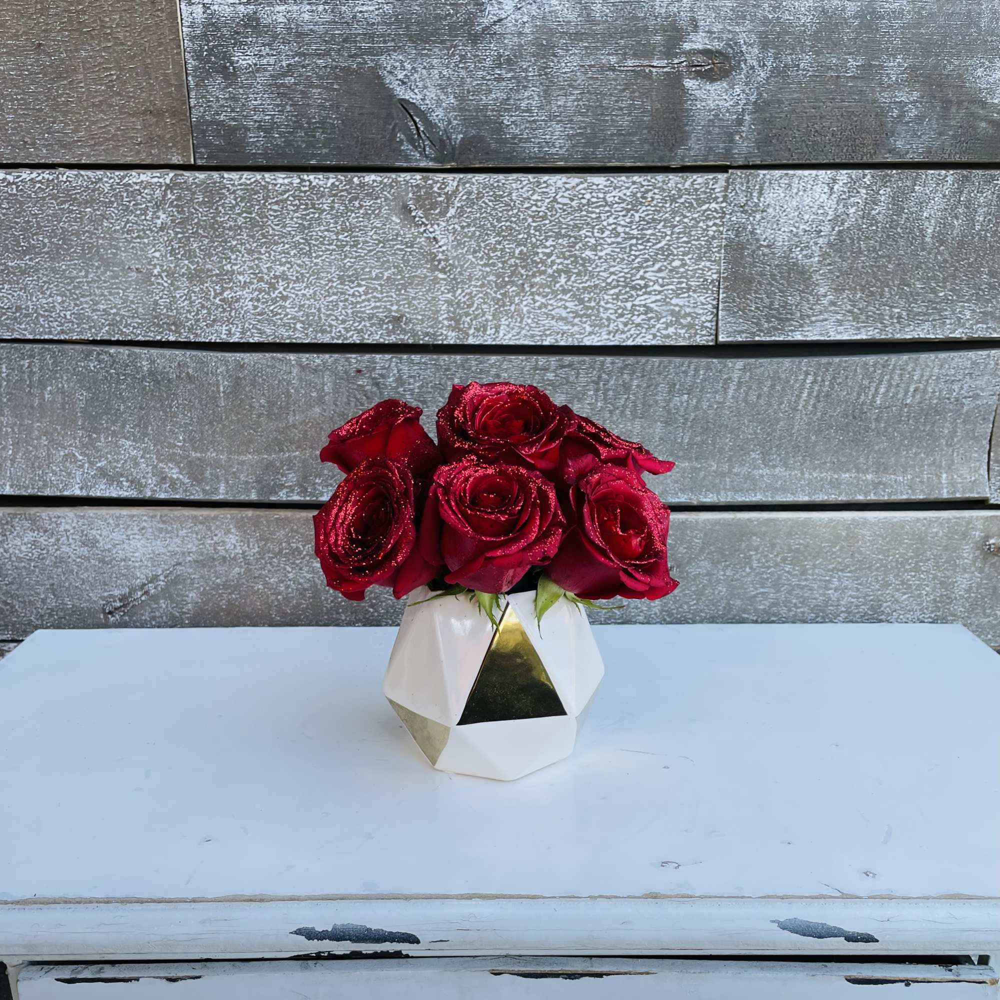 Half dozen Glittered red roses in a small bud vase Half dozen Glittered red roses in a small bud vase