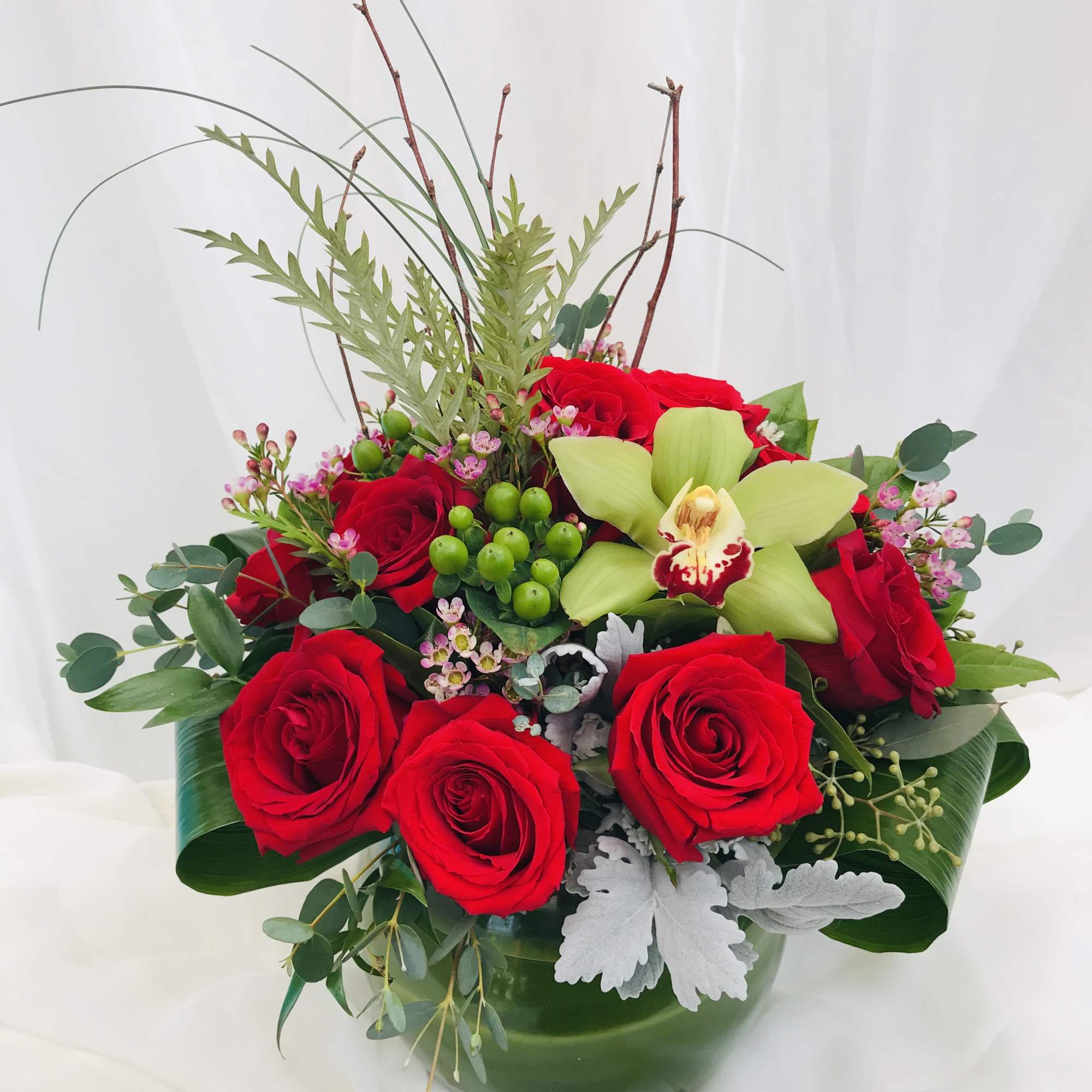 This gorgeous Valentine&#039;s Day arrangement consist of a dozen red roses and