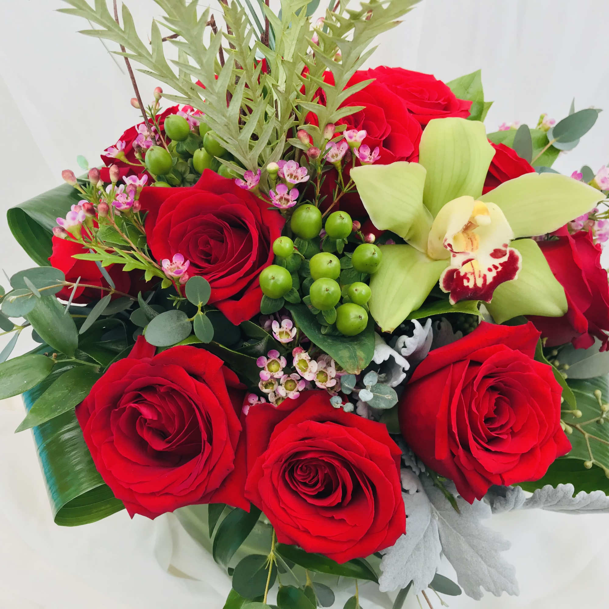 This gorgeous Valentine&#039;s Day arrangement consist of a dozen red roses and
