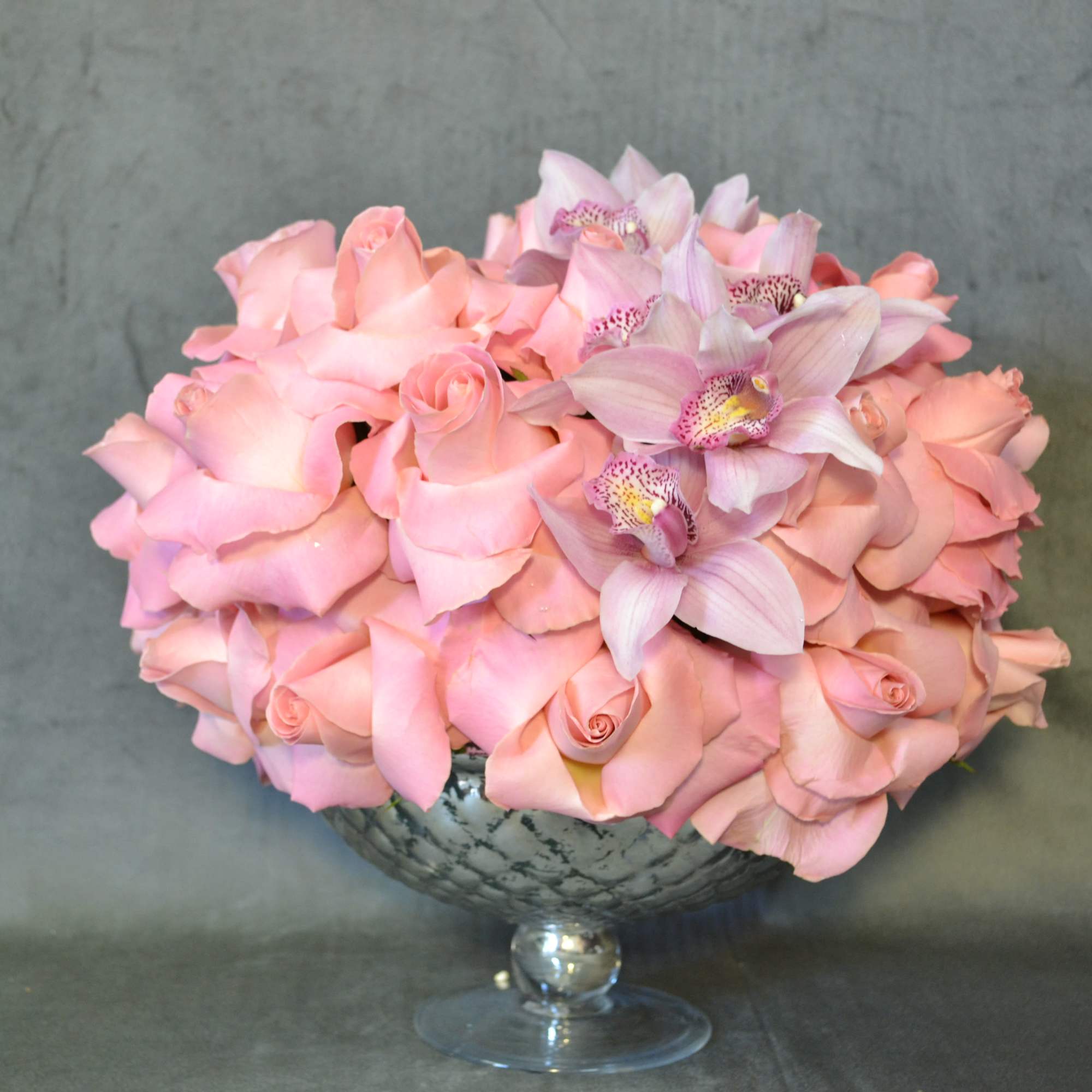 A large  mercury  mirror  urn ball, of pastels pink