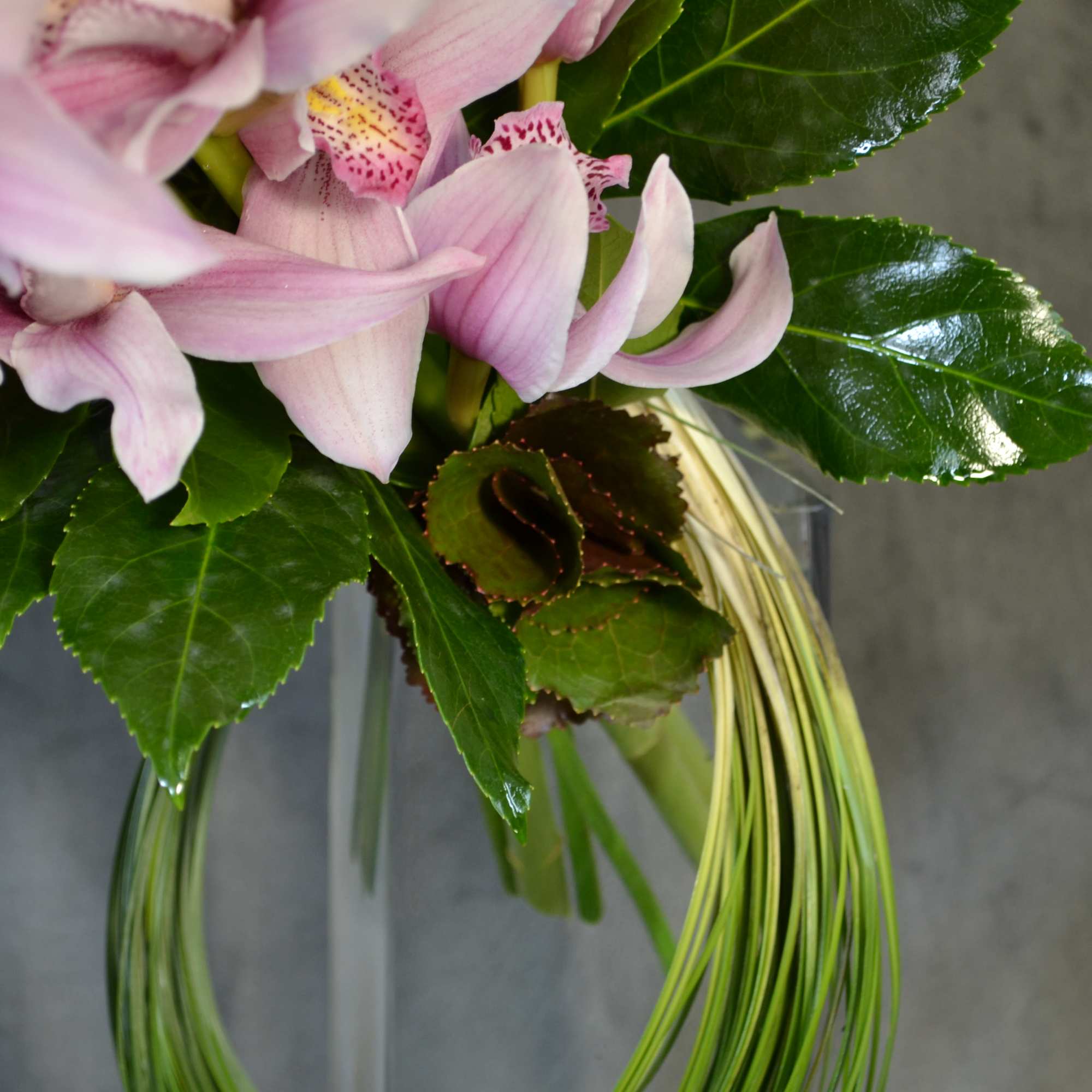 Orchids decorated with delicate greens.