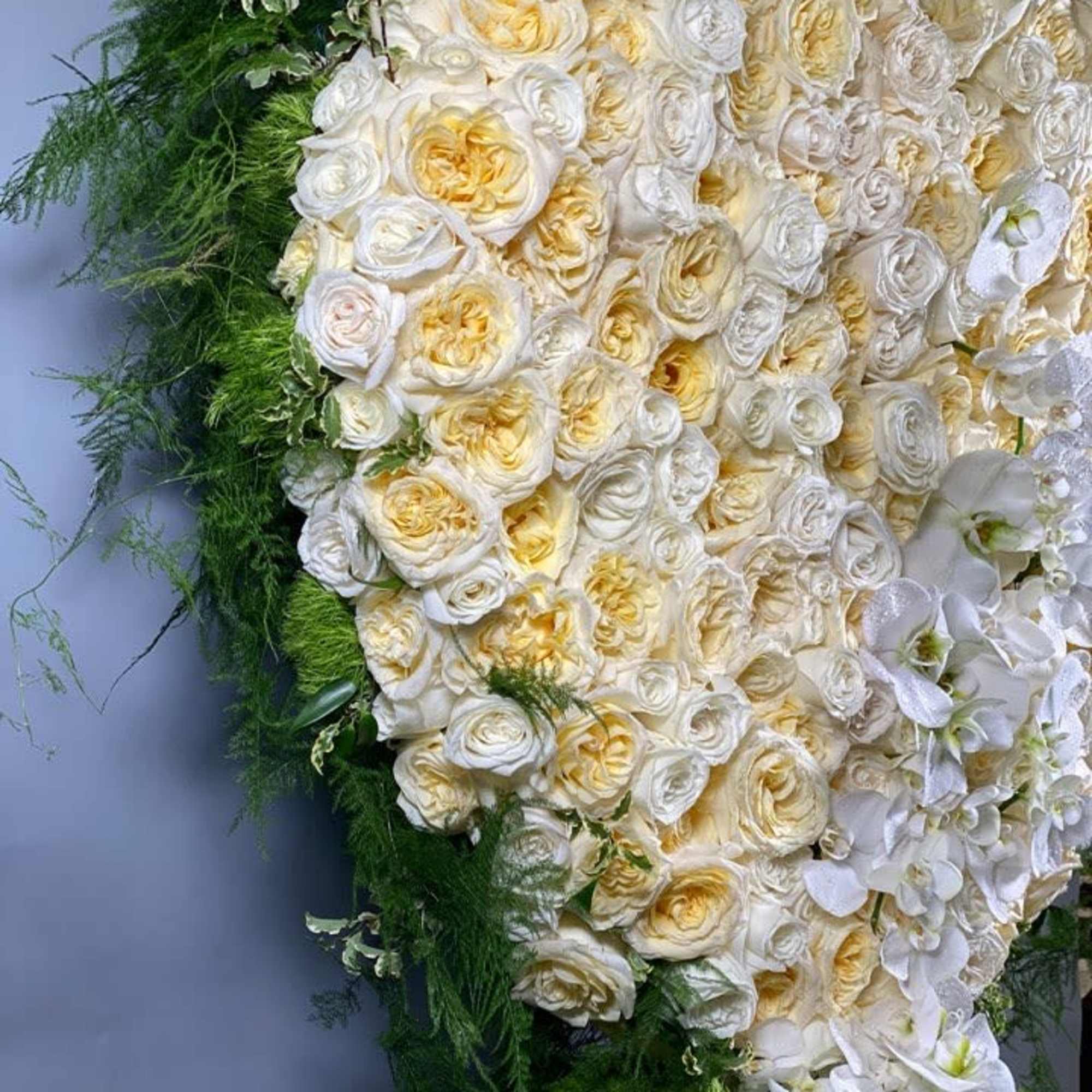 This giant heart is full of buttercream and white roses and accented