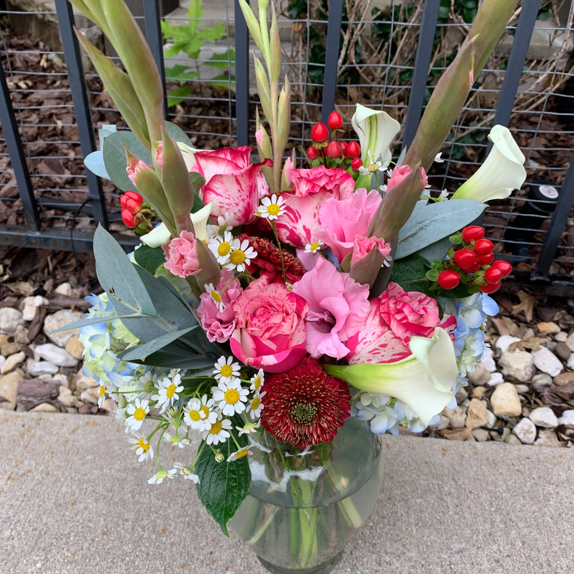A colorful arrangement to brighten anyone&rsquo;s day! The designer will select the