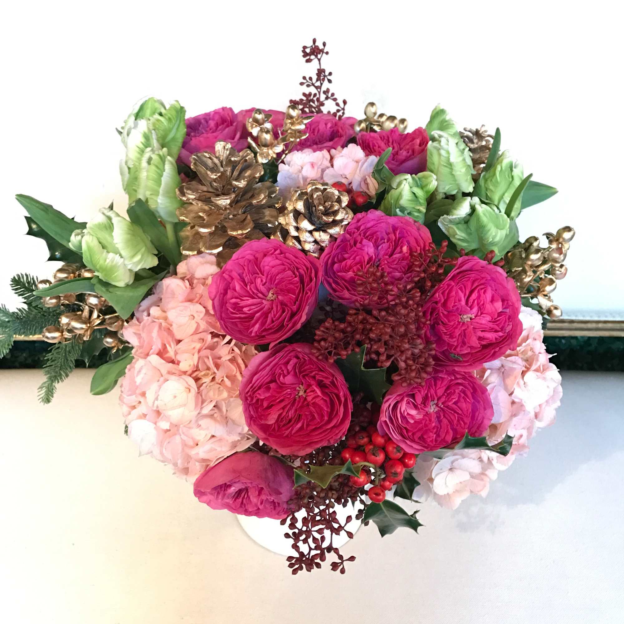 Beautiful and lush arrangement. Traditional with a modern twist. Flowers include parrot