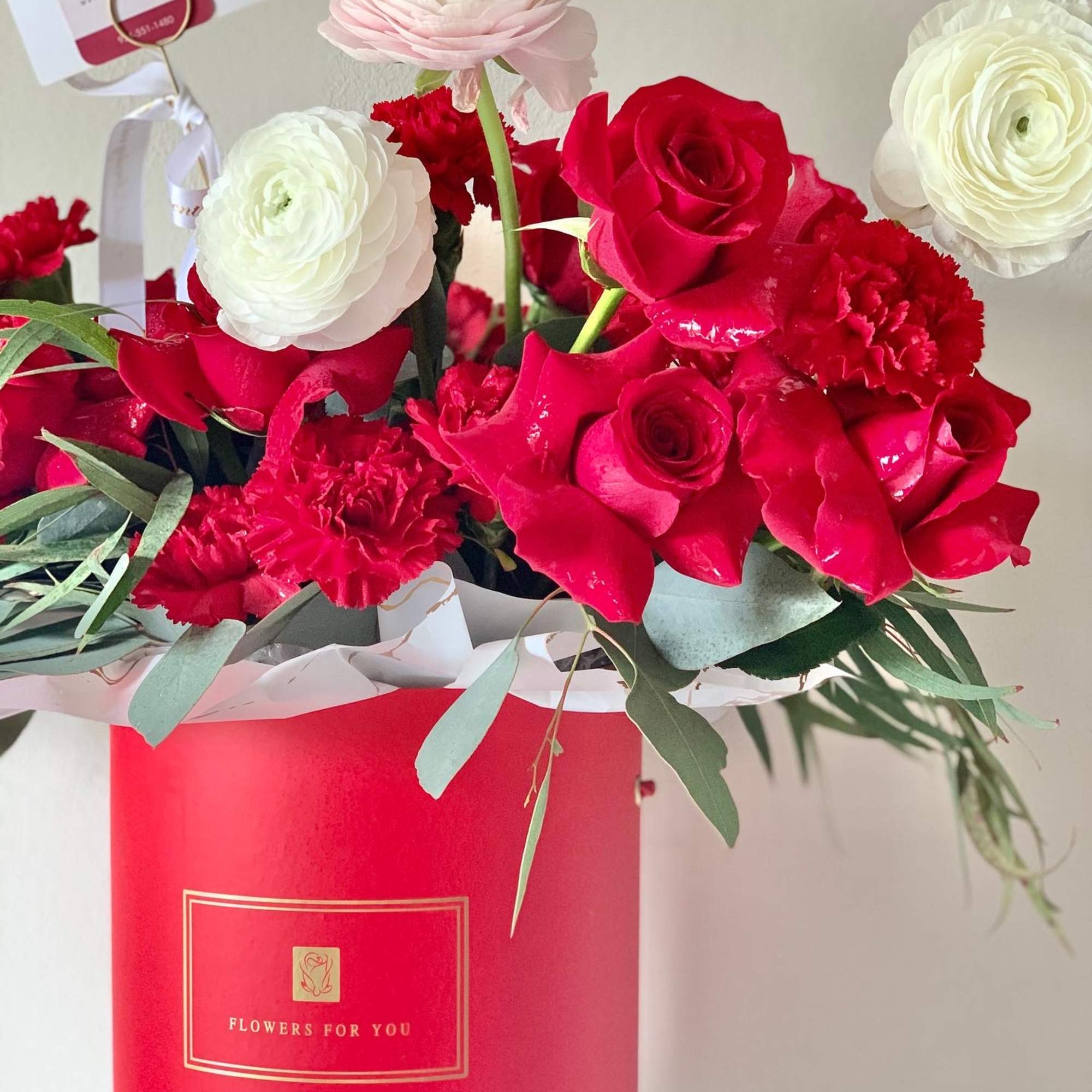 Fresh flower arrangements with greeneries in a floral box will be delivered