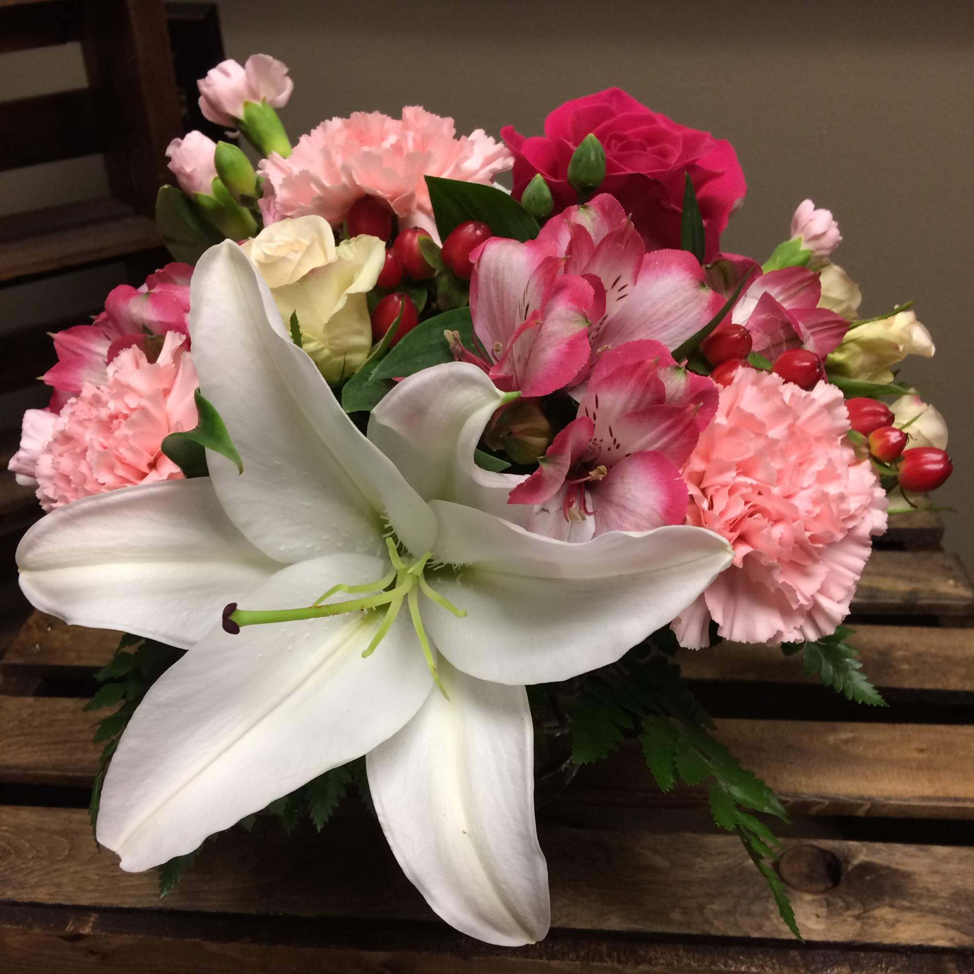 Orange Gladiolas, Violet Carnations, White Spider Mum, Snapdragons arranged in a Basket