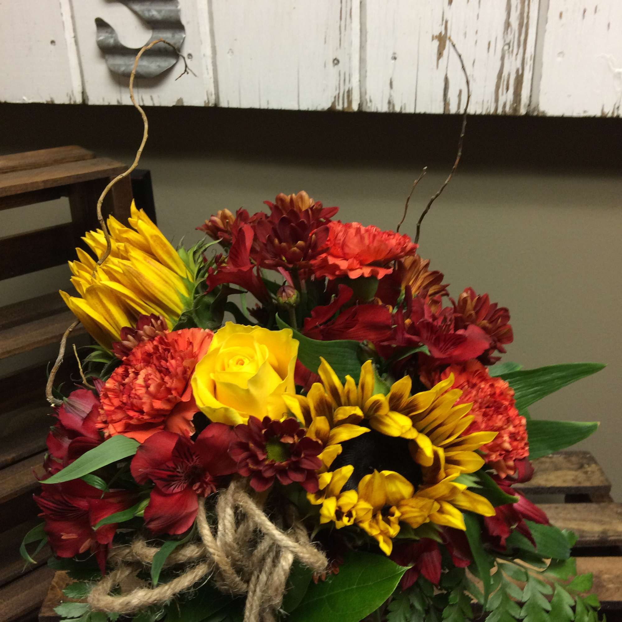 Orange Gladiolas, Violet Carnations, White Spider Mum, Snapdragons arranged in a Basket