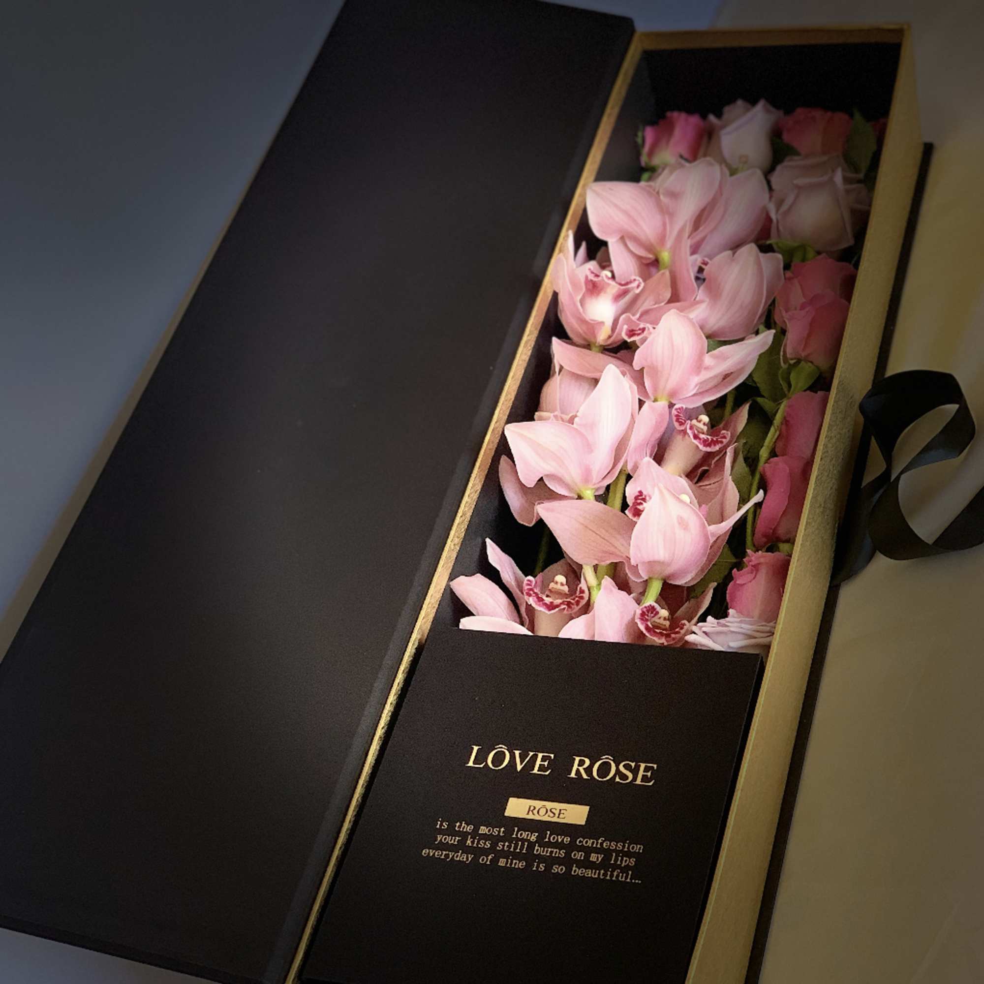 A box includes one full steam of rare Cymbidium orchid. That orchid