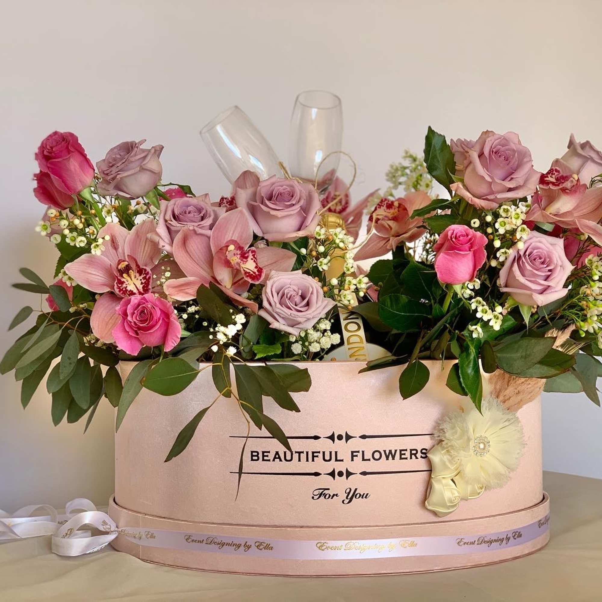 Extra large flower arrangement. Floral arrangement consist of 25 roses, eucalyptus, wax