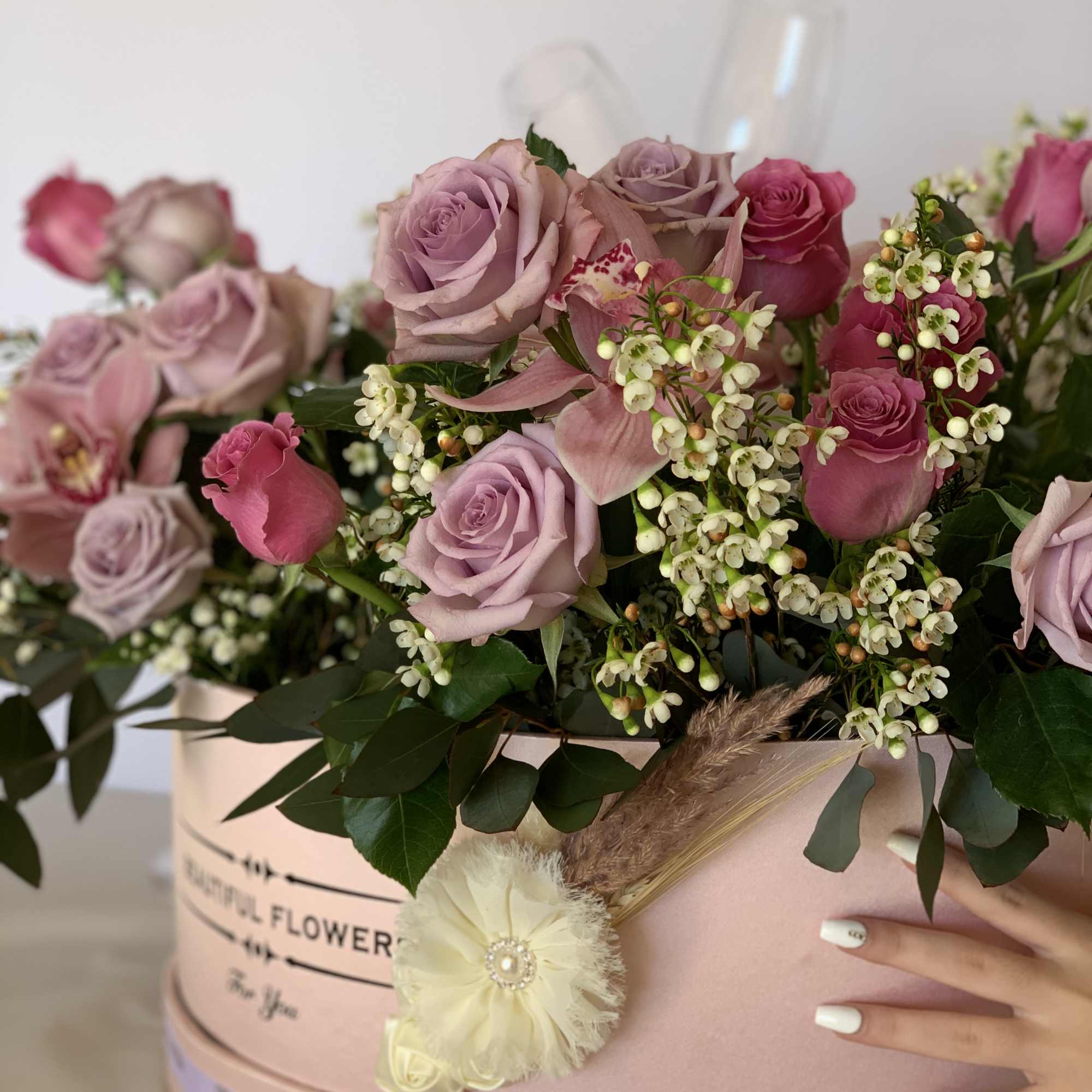 Extra large flower arrangement. Floral arrangement consist of 25 roses, eucalyptus, wax