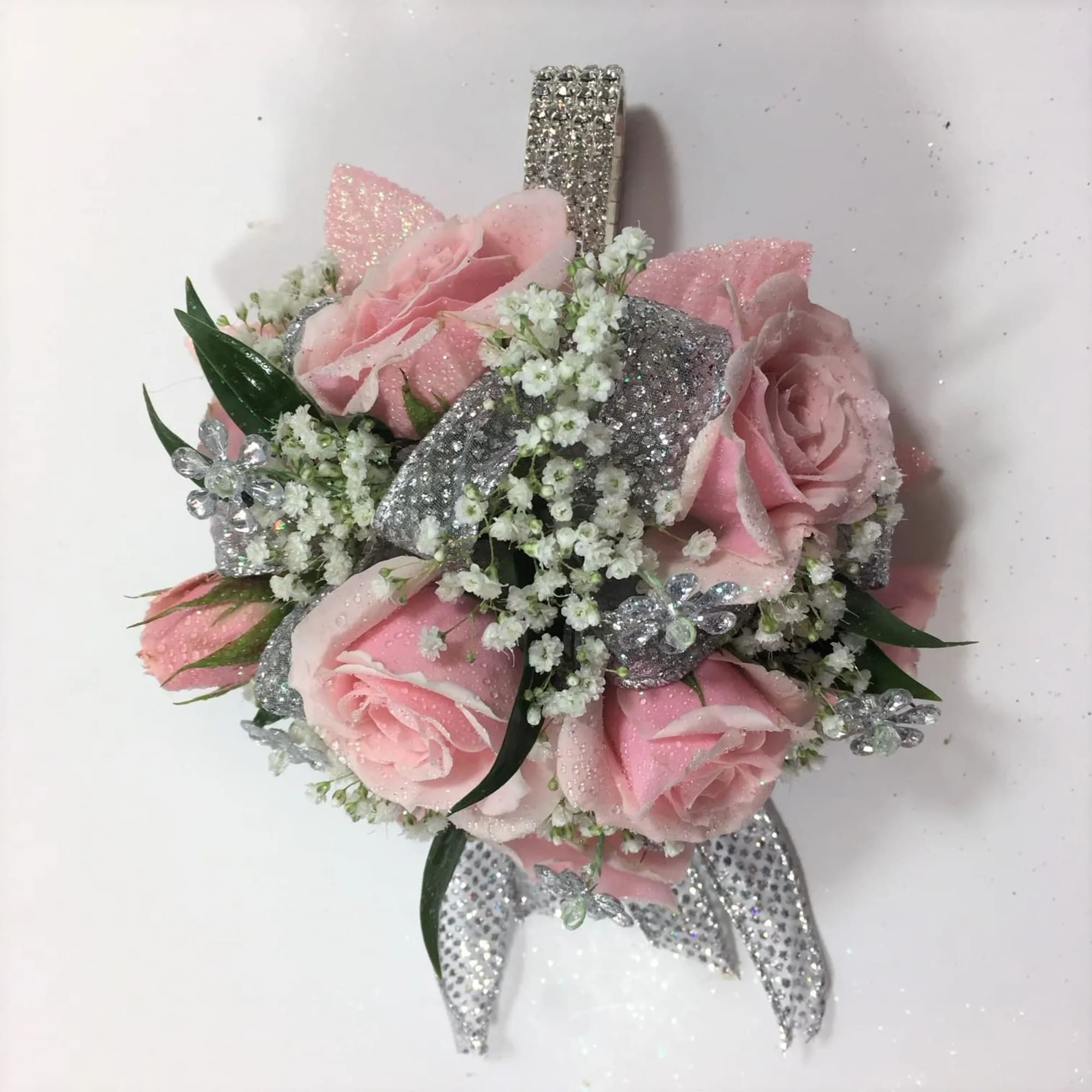 This pink rose wristlet has the beautiful keepsake rhinestone bracelet.  Just