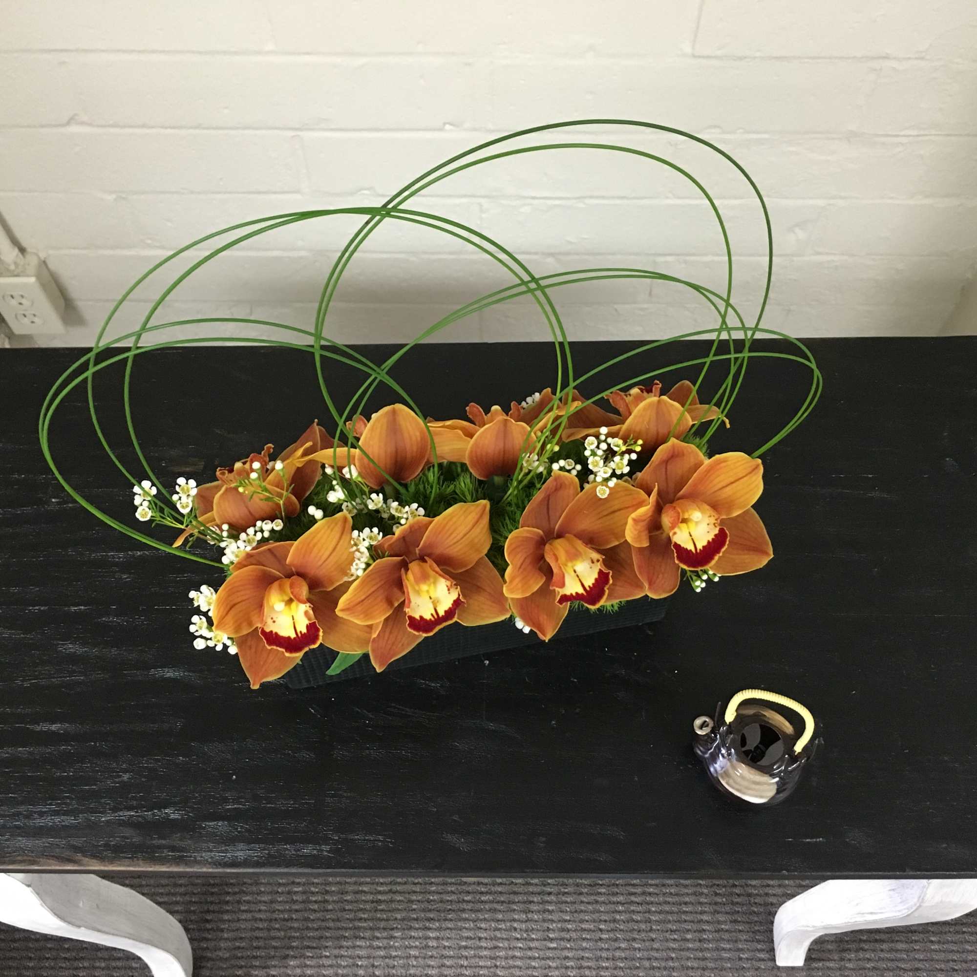 Dimensions:  10L x 3W x 7H  Elegant Orchid arrangement with