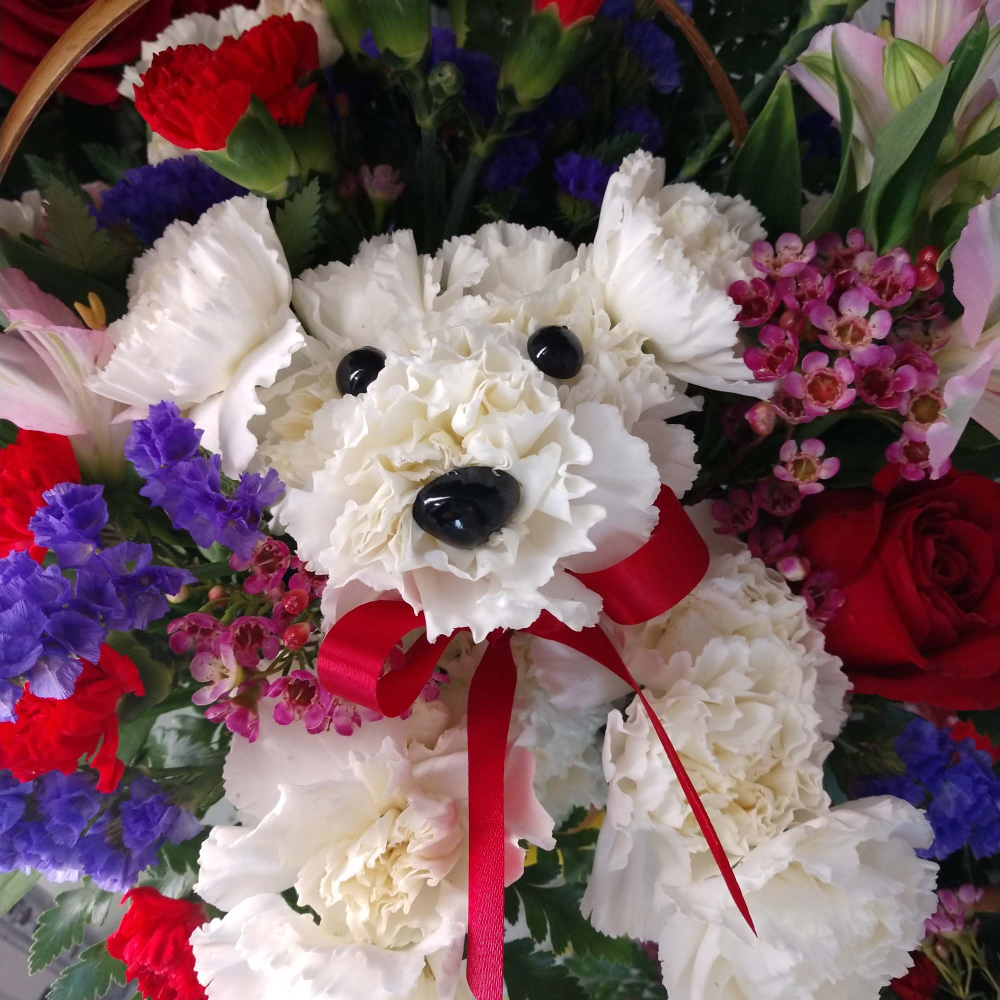 arrangement with white carnations  red mini carnation purple statice wax flowers arrangement with white carnations  red mini carnation purple statice wax flowers