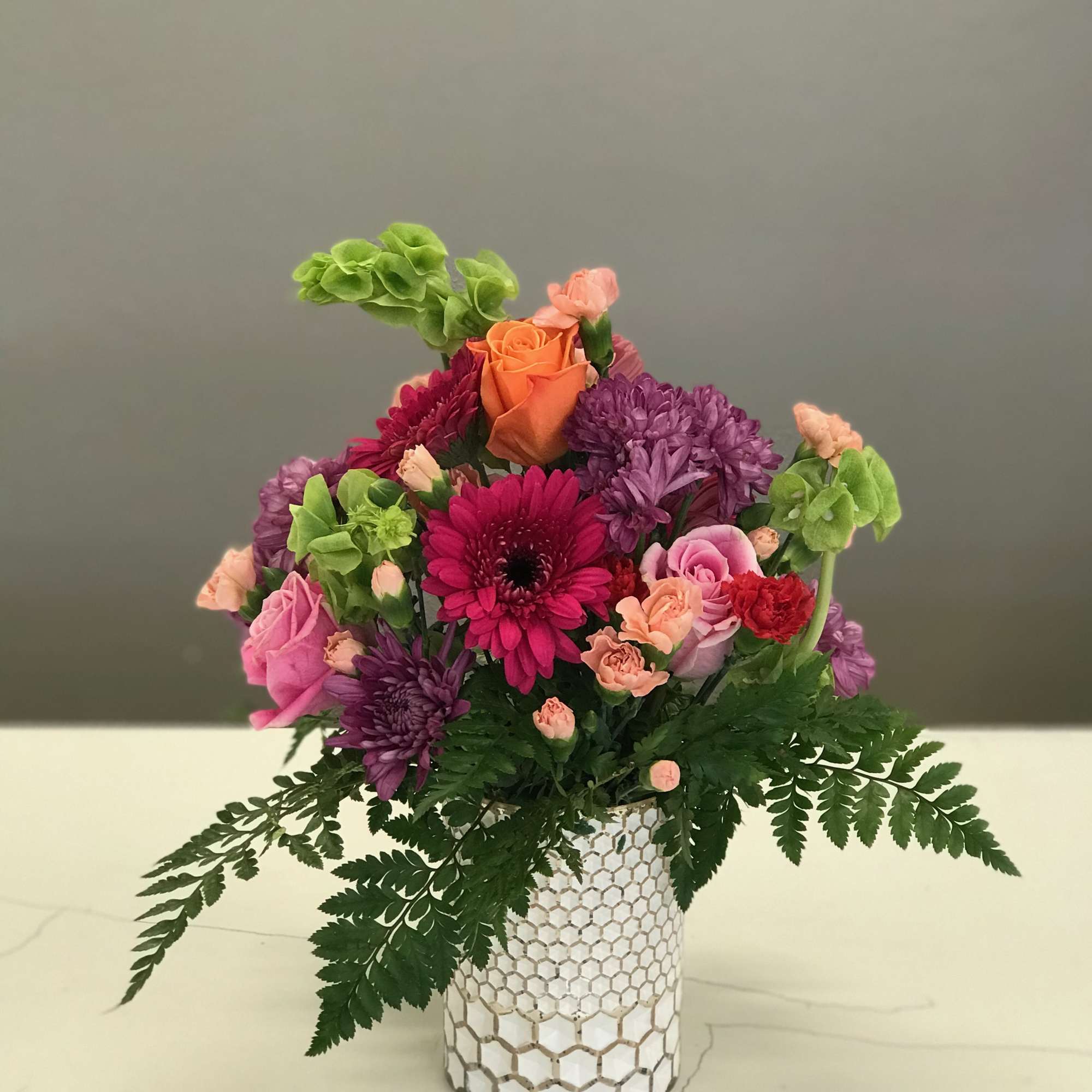 Colorful blooms full of spilling over remind one of reaching into grandma&#039;s