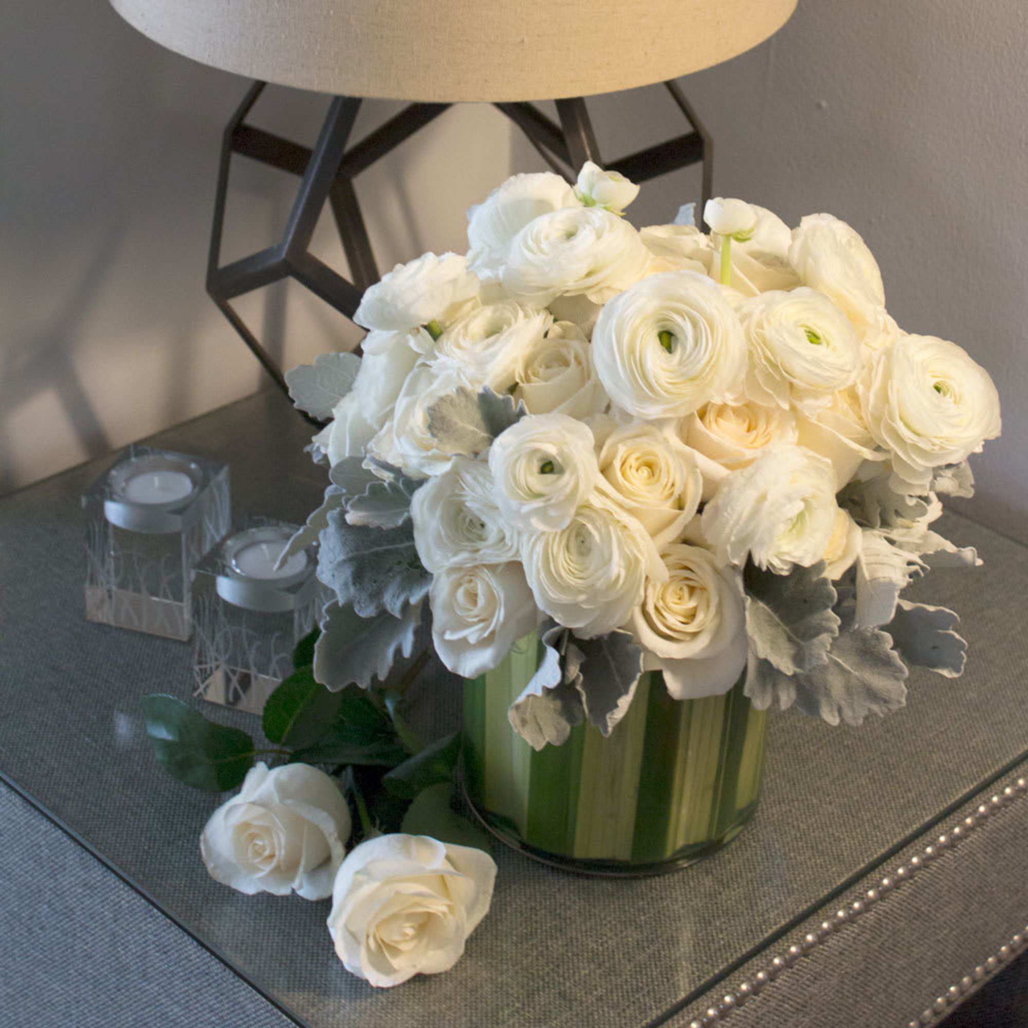 Full of life and natural beauty, this arrangement features a leaved glass