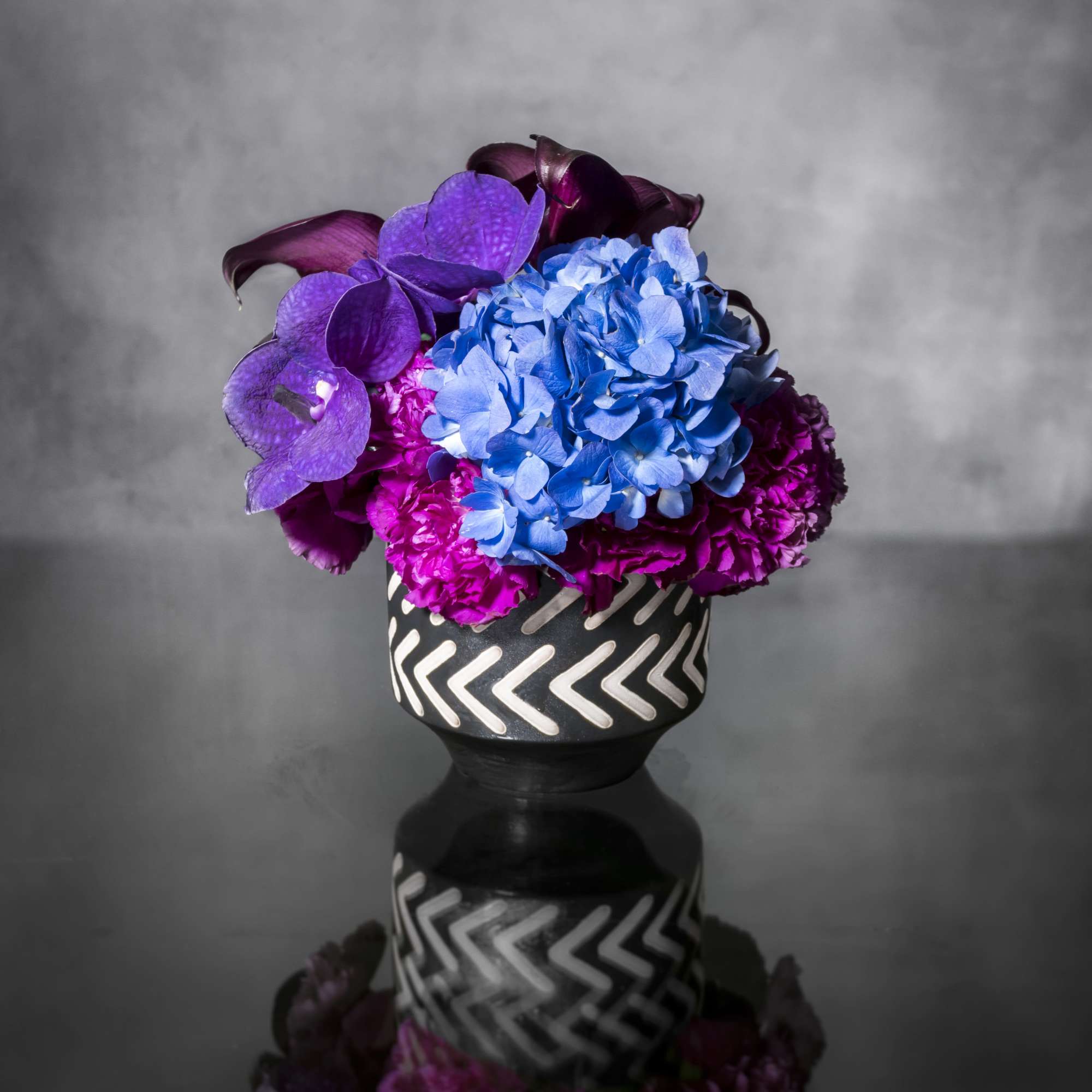 Oooo-la-la! Lavish and lovely, this assortment of specialty florals in shade of