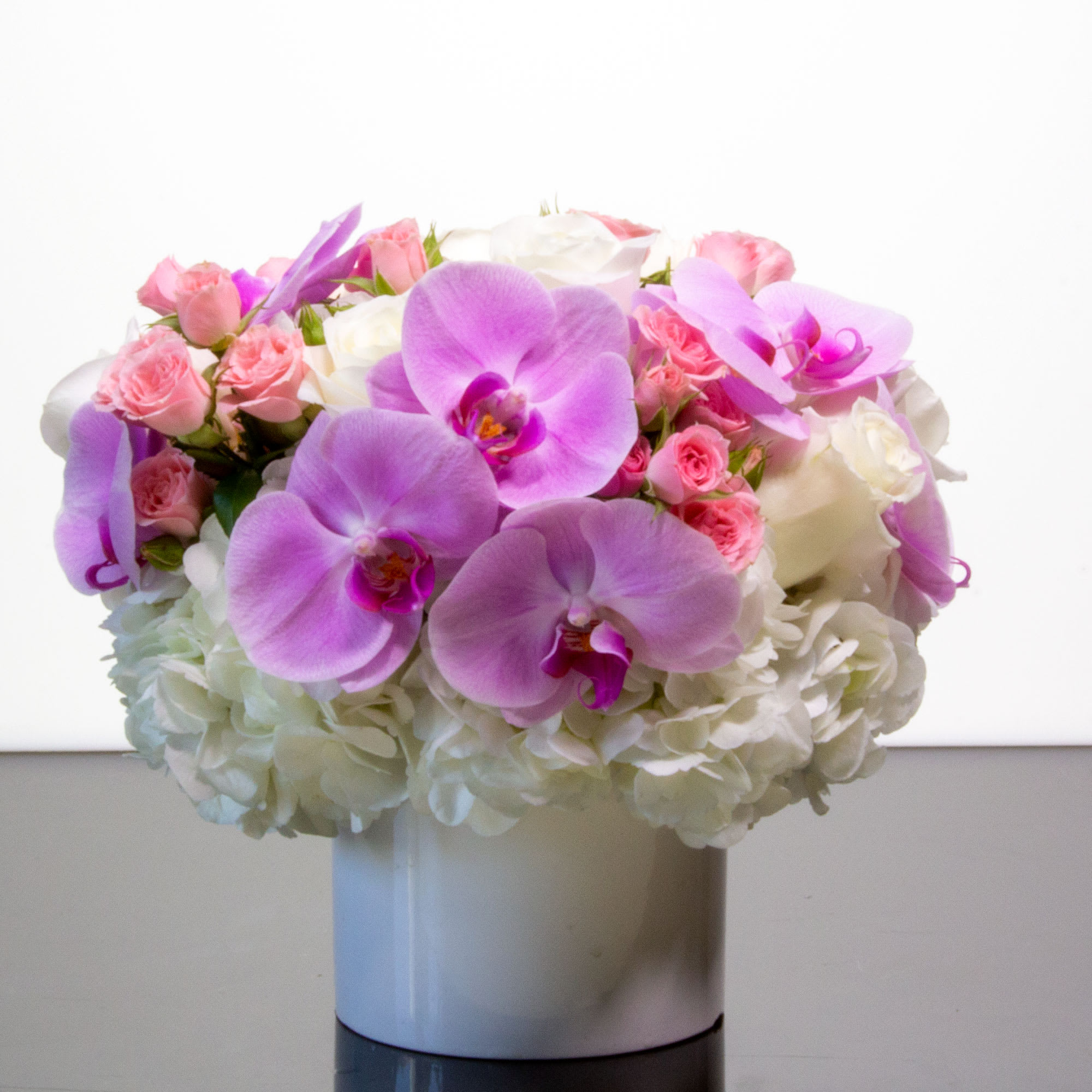 Uniquely designed to create a memorable impression, this spectacular arrangement of beautiful