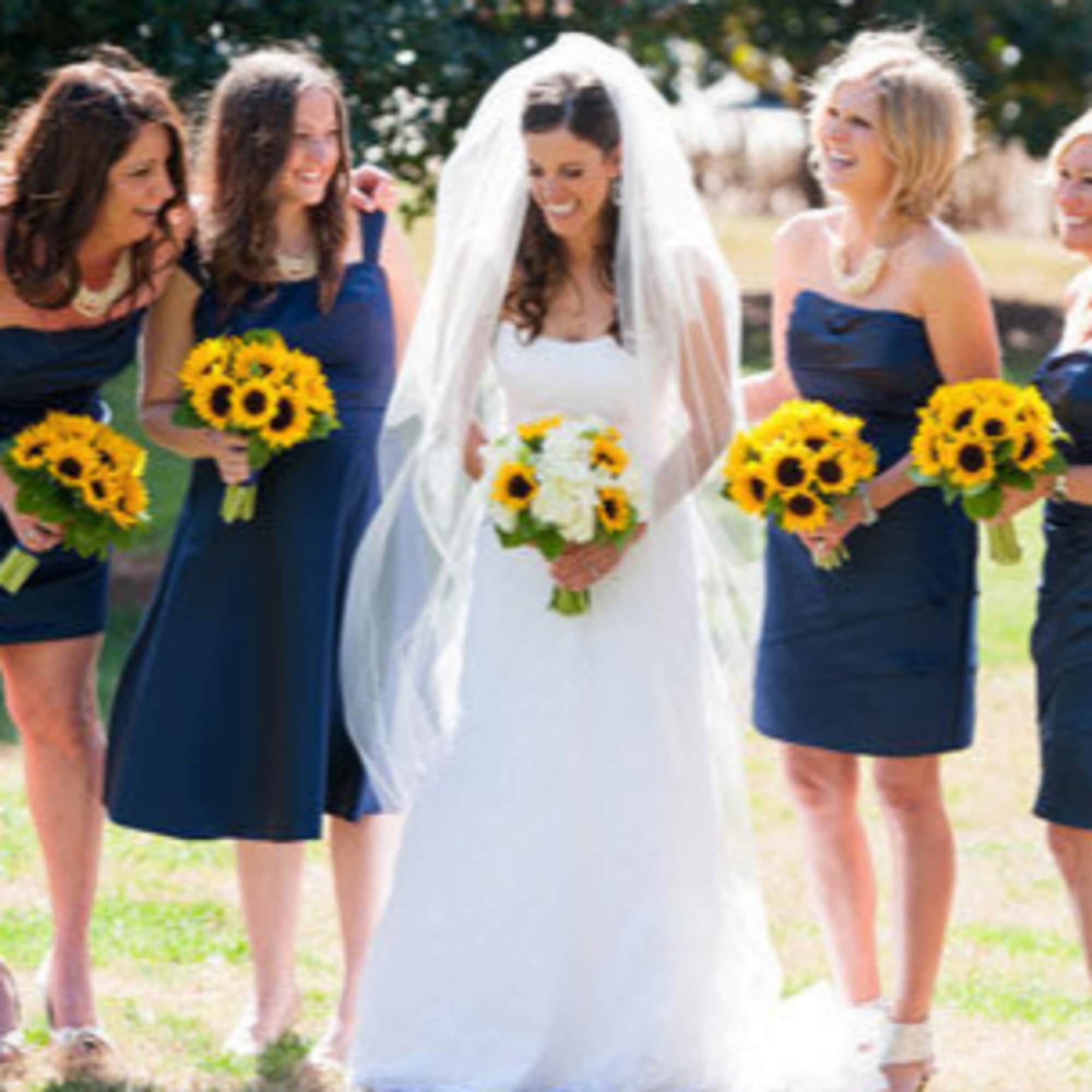 1 Bridal Bouquet (5 sunflowers, 2 white hydrangeas, greens)
3 bridesmaids ( each