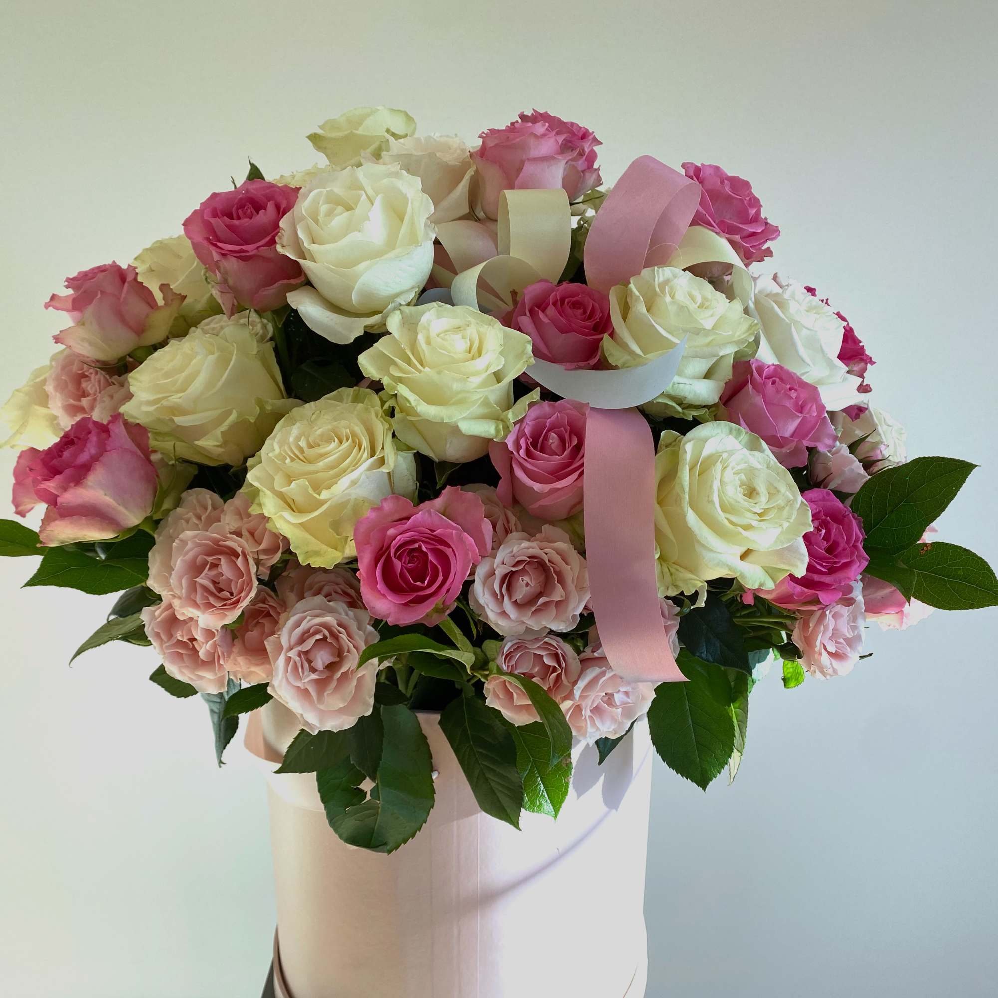 An Elegant display of large bloom pink &amp; white roses in a