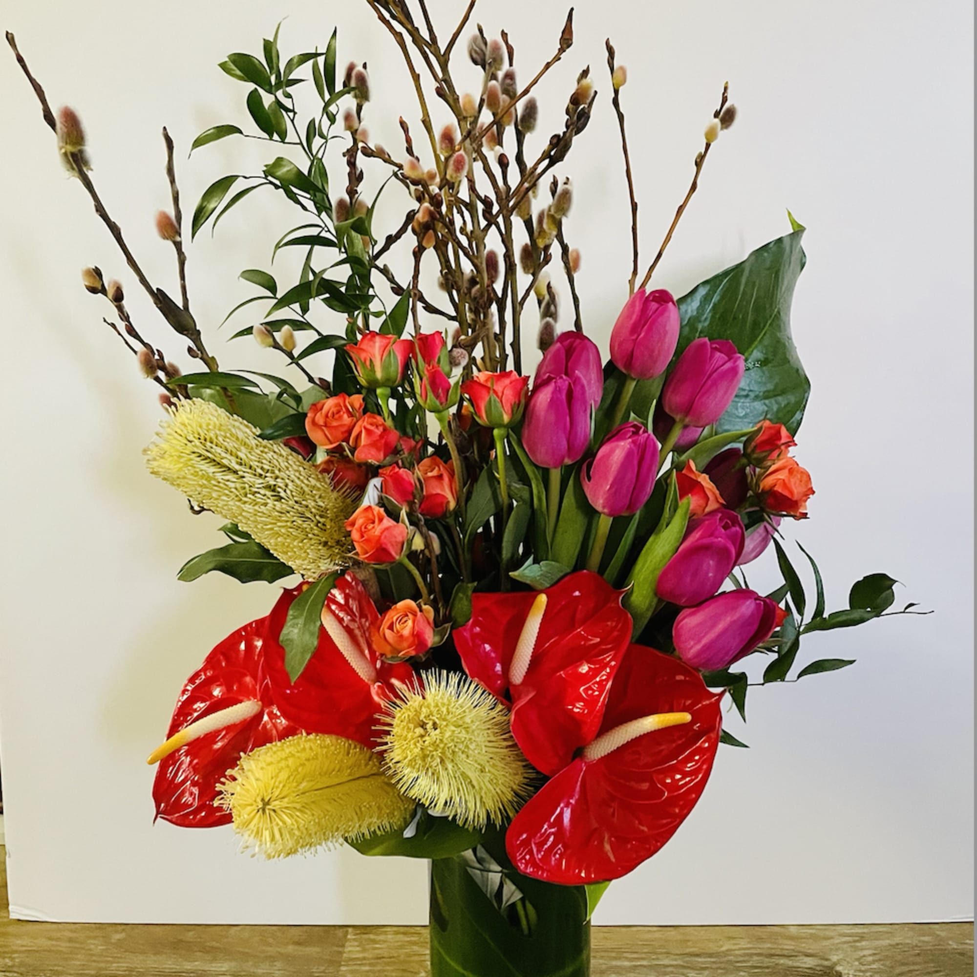 A combination of tropical foliage and tropical blooms. The perfect display for