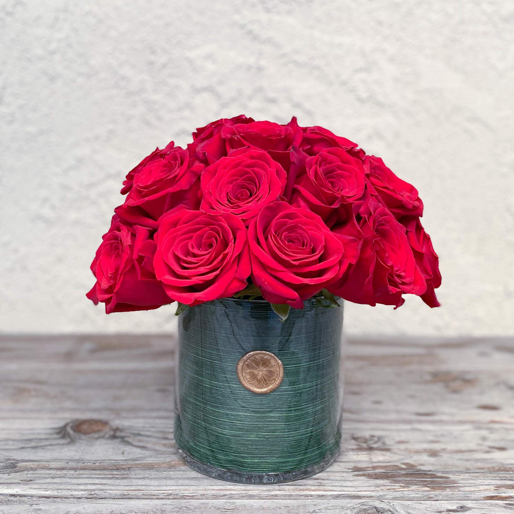 This timeless classic features two dozen red roses accented with leafy greens This timeless classic features two dozen red roses accented with leafy greens