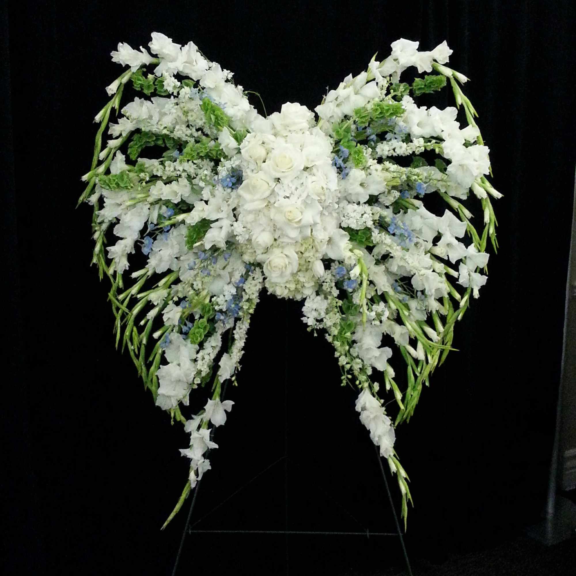 Open lattice angel wings on a standing easel. Open lattice angel wings on a standing easel.