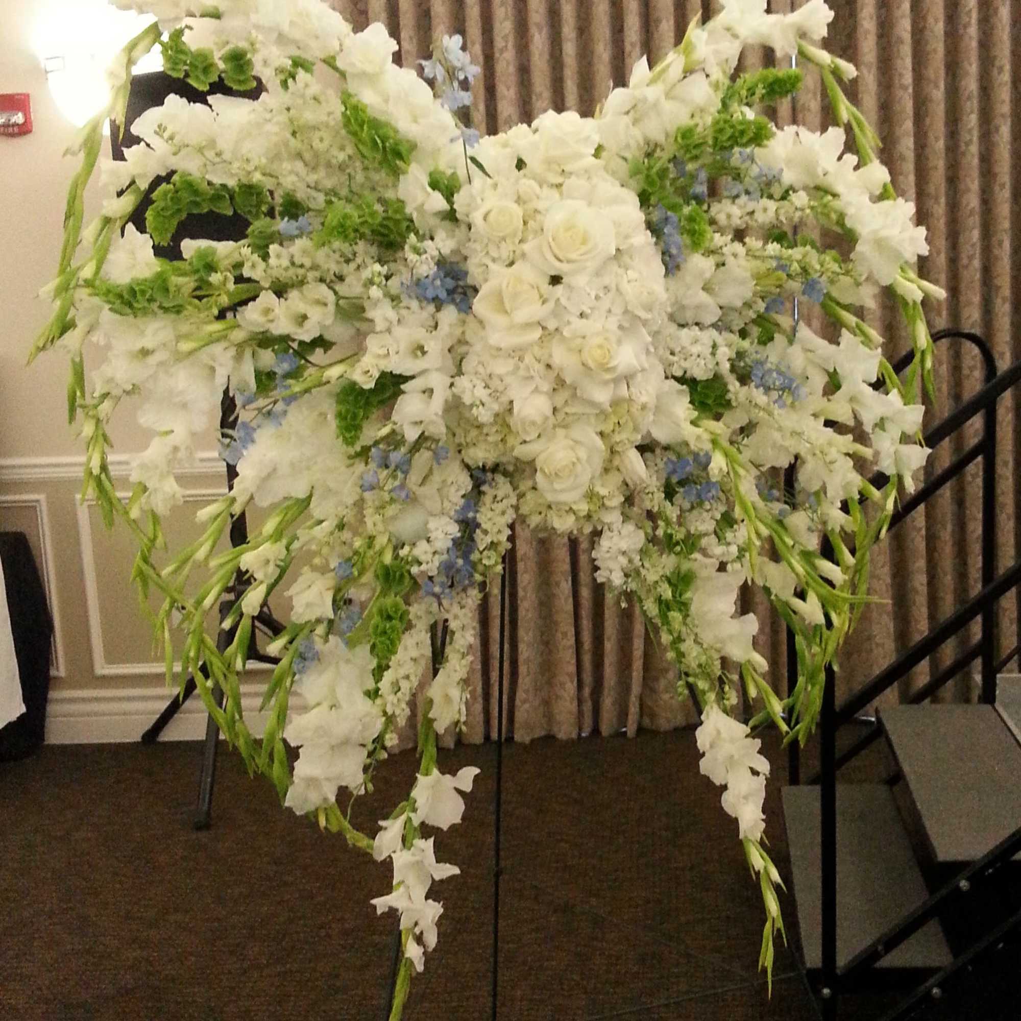 Open lattice angel wings on a standing easel. Open lattice angel wings on a standing easel.