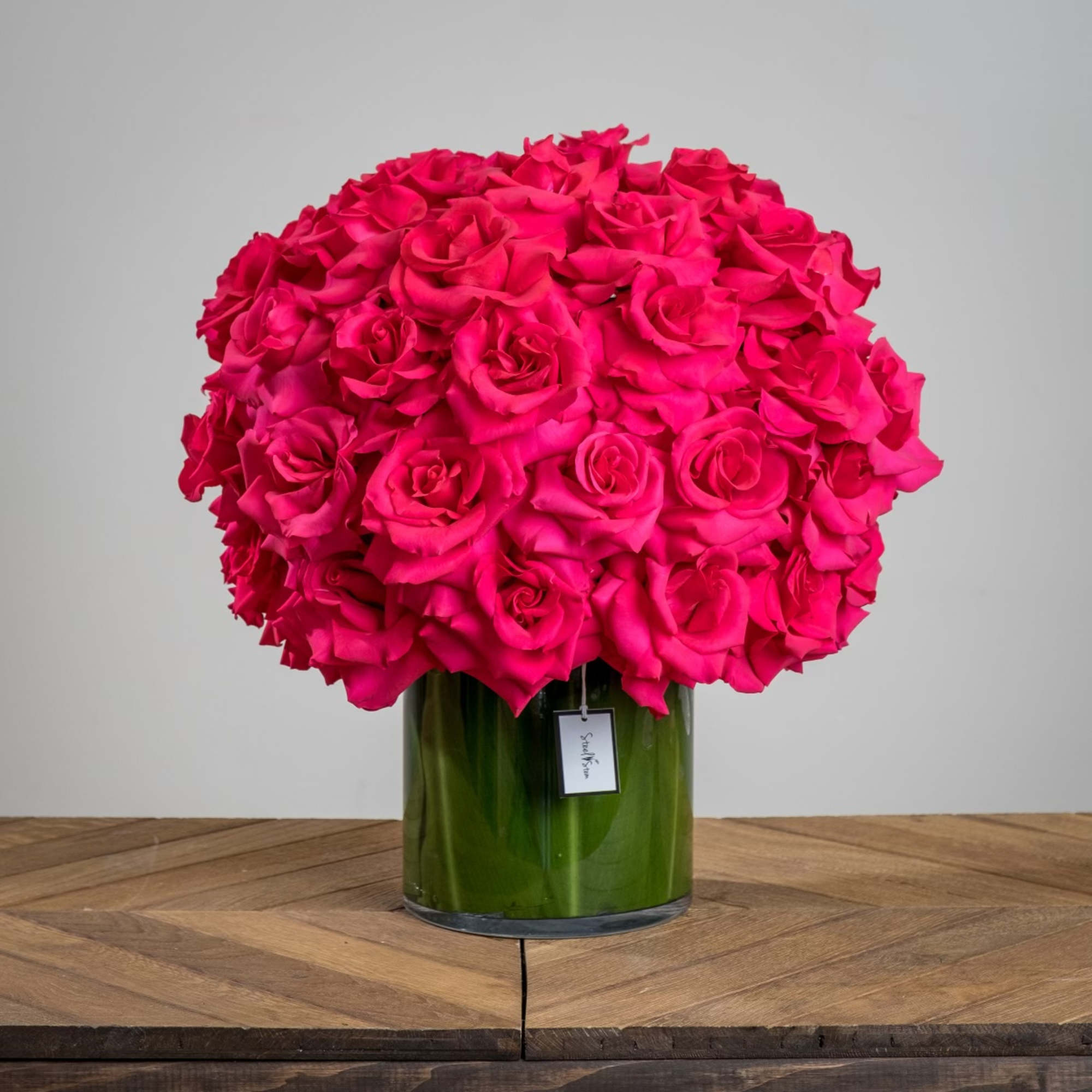 A large glass cylinder with a fresh leaf-line is exploding with fifty A large glass cylinder with a fresh leaf-line is exploding with fifty