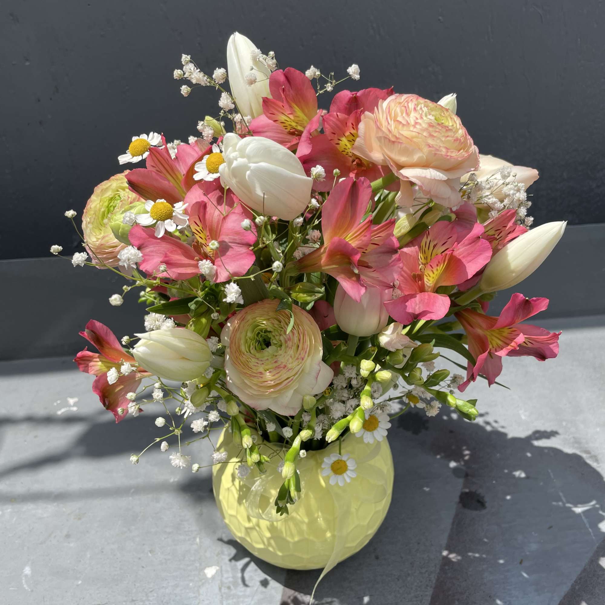 Spring blooms in cute vase