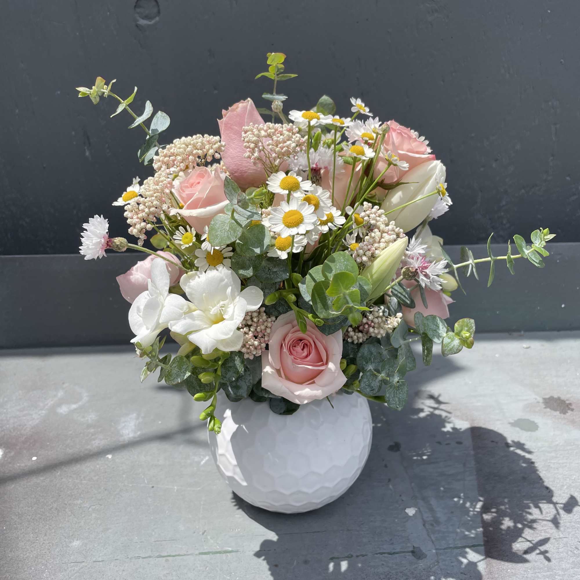 Spring blooms in cute vase