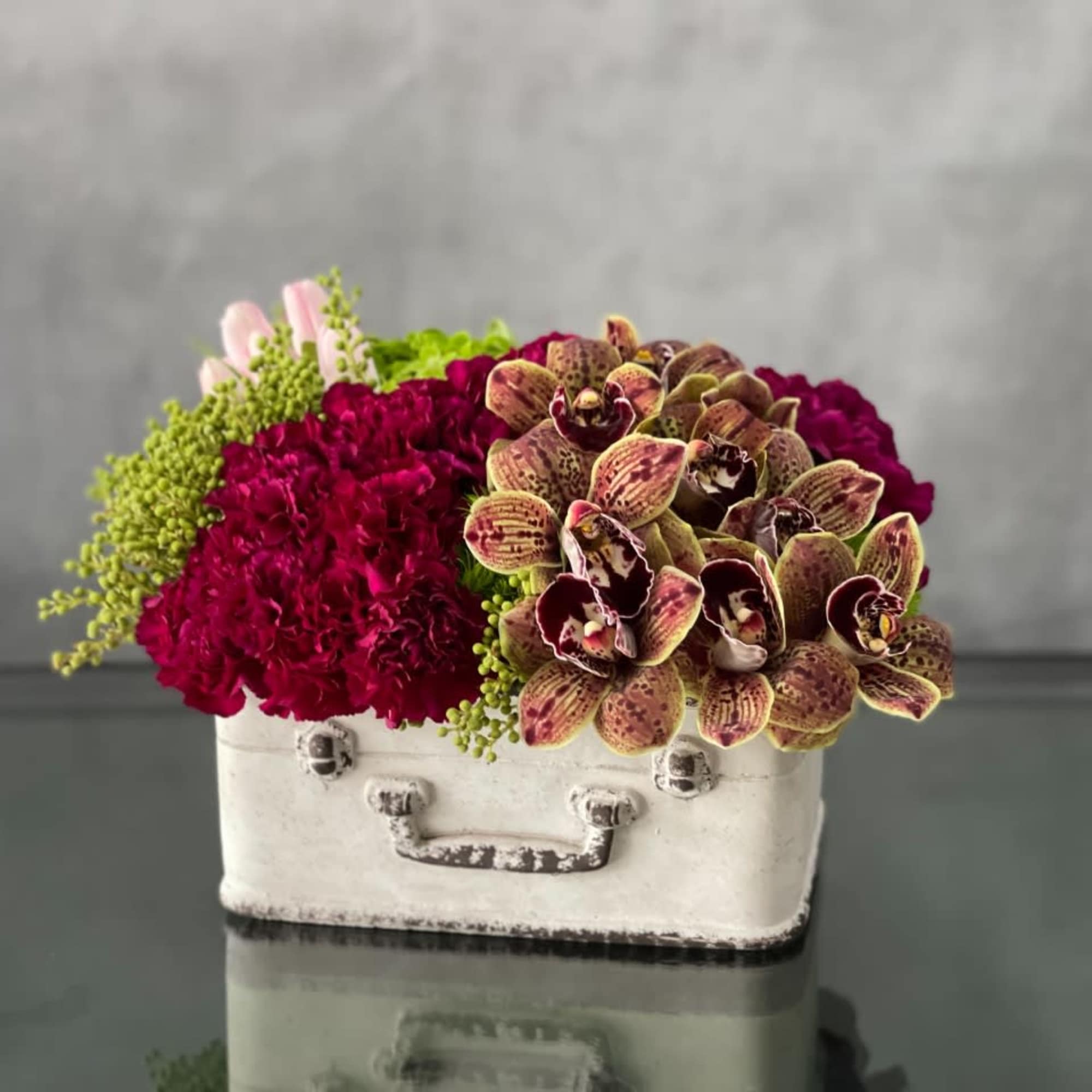 This whimsical set of suitcase planters is a great gift to someone