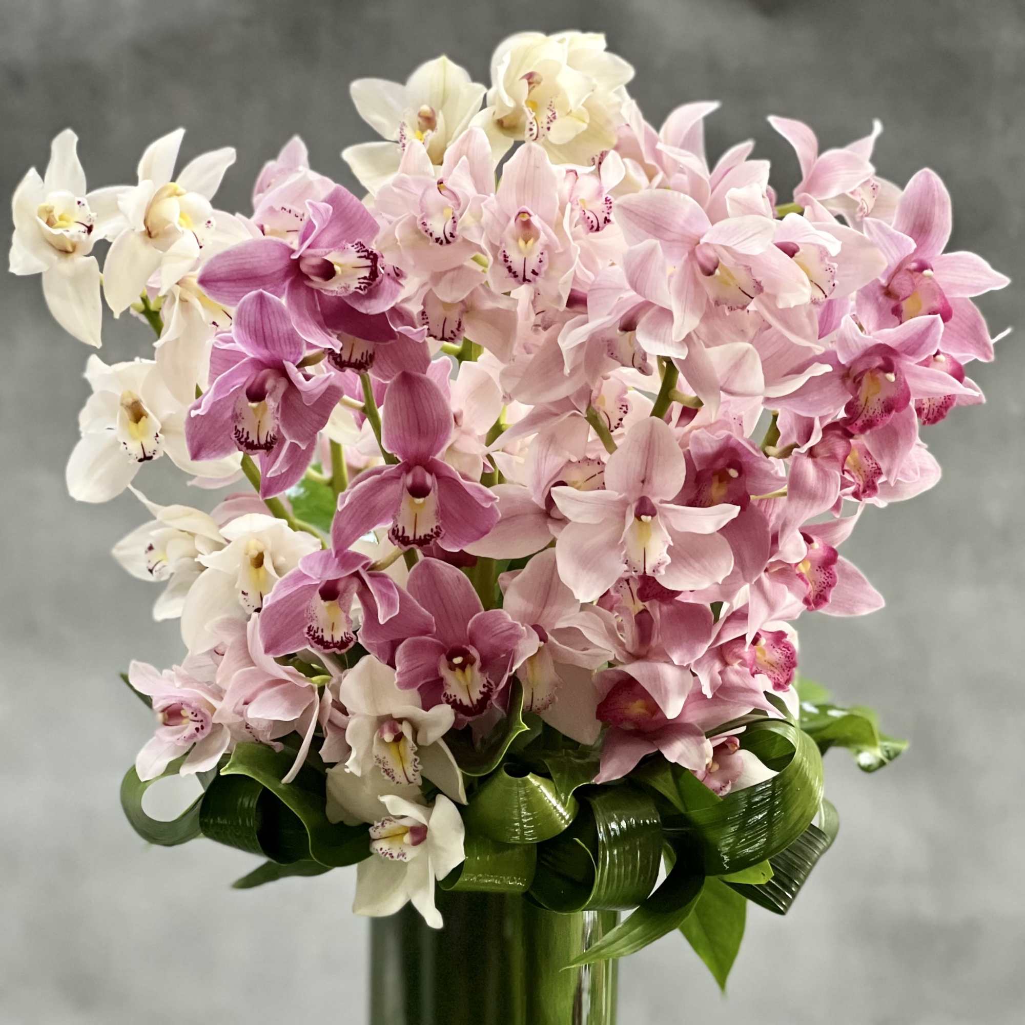 Deliver happiness and joy with this magnificent floral design that features a