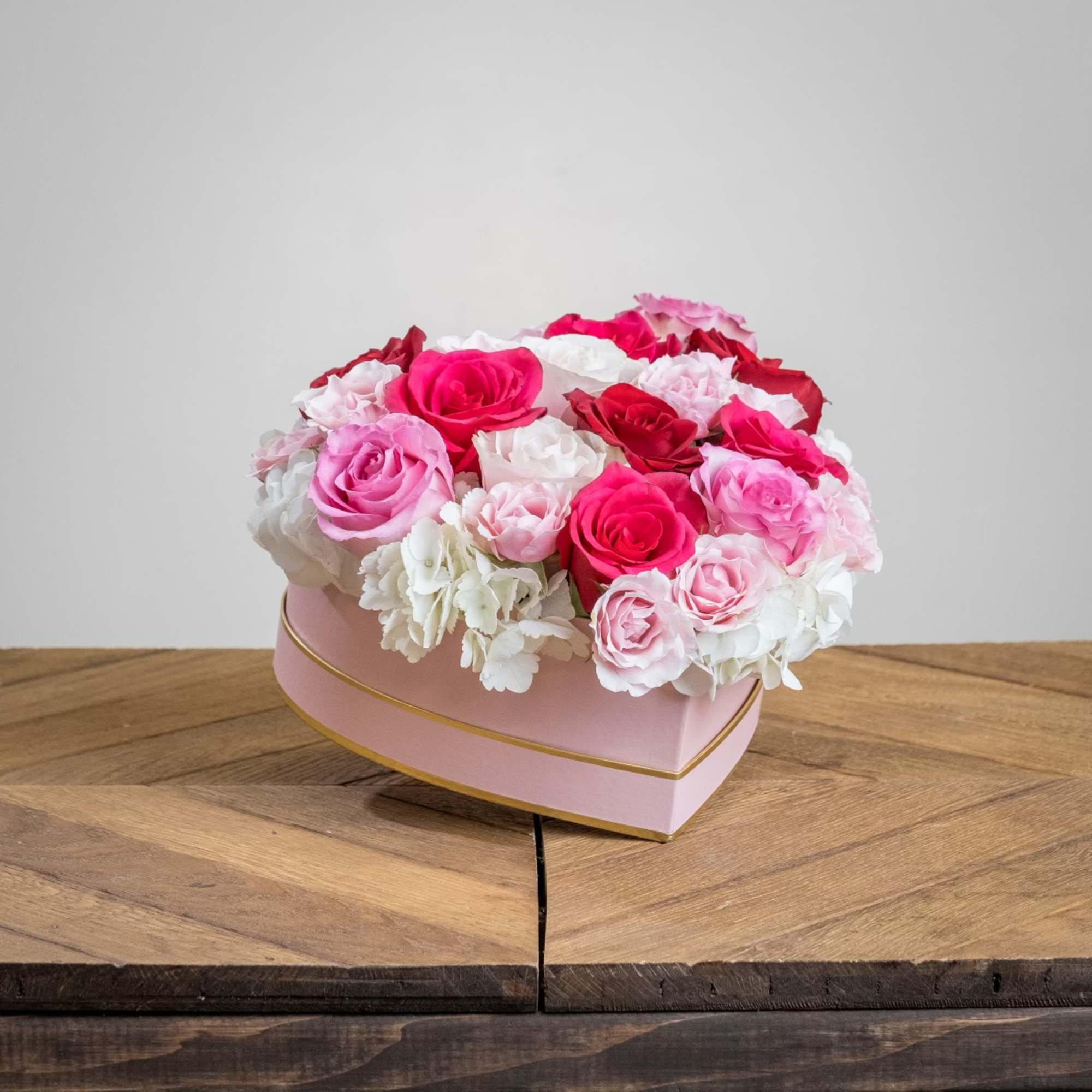 A gorgeous light pink heart shaped box with elegant white hydrangeas and A gorgeous light pink heart shaped box with elegant white hydrangeas and