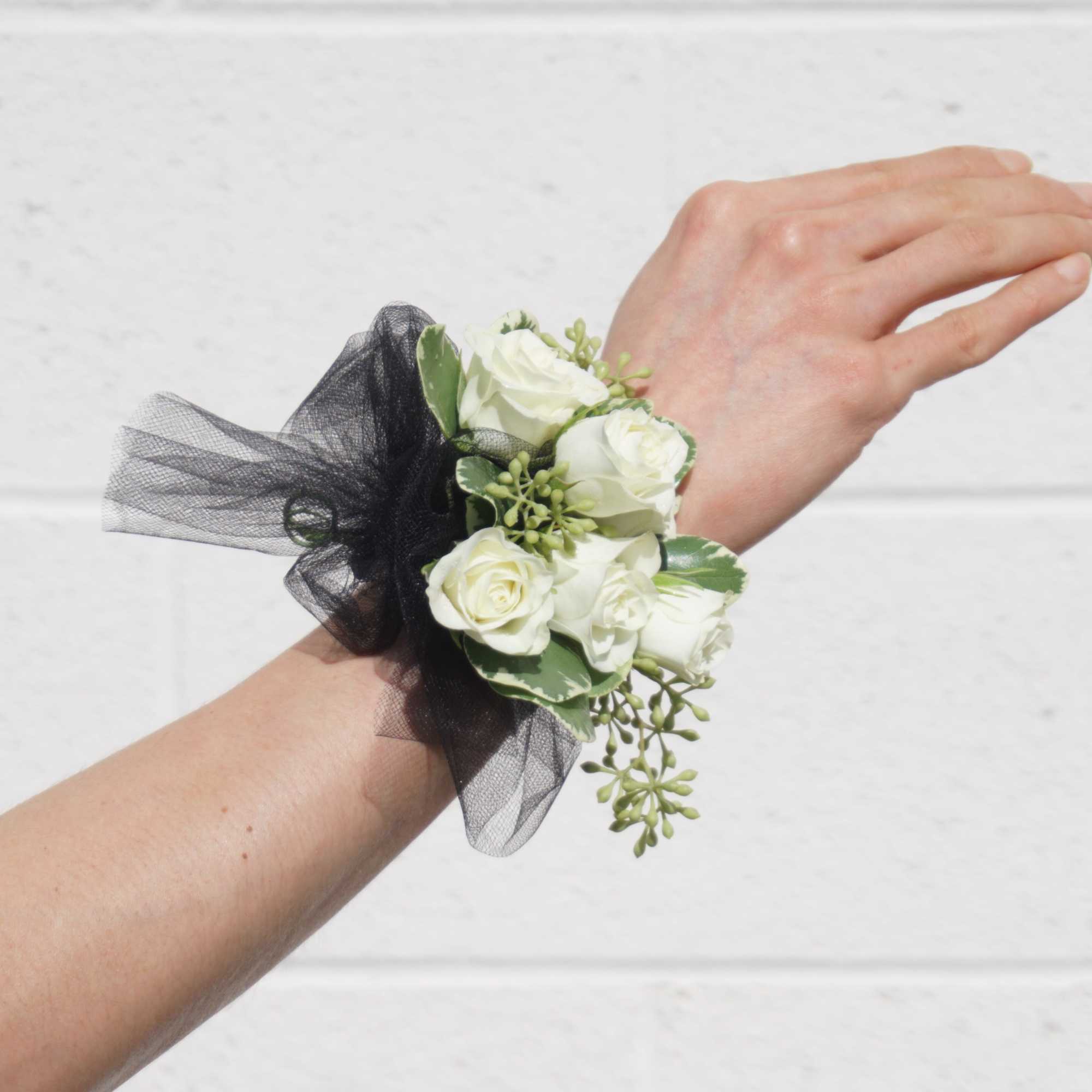 Wrist corsage with white roses and accents. CUSTOMER CAN CHOOSE ANY COLOR
STANDARD: