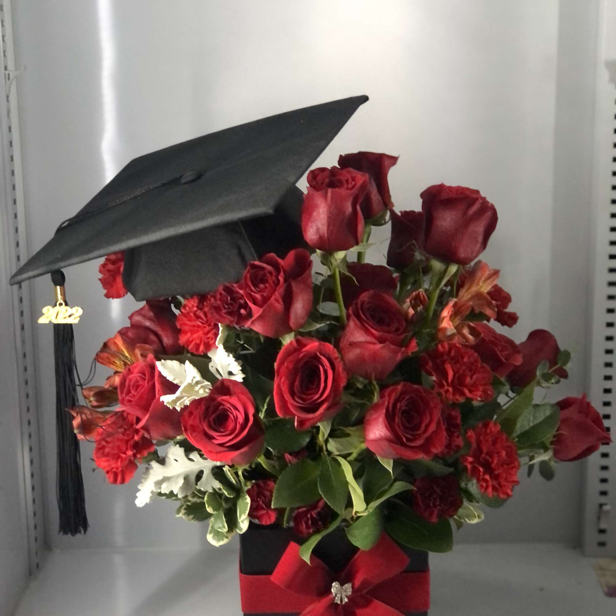 Beautiful Graduation arrangement ,  color can be substituted 