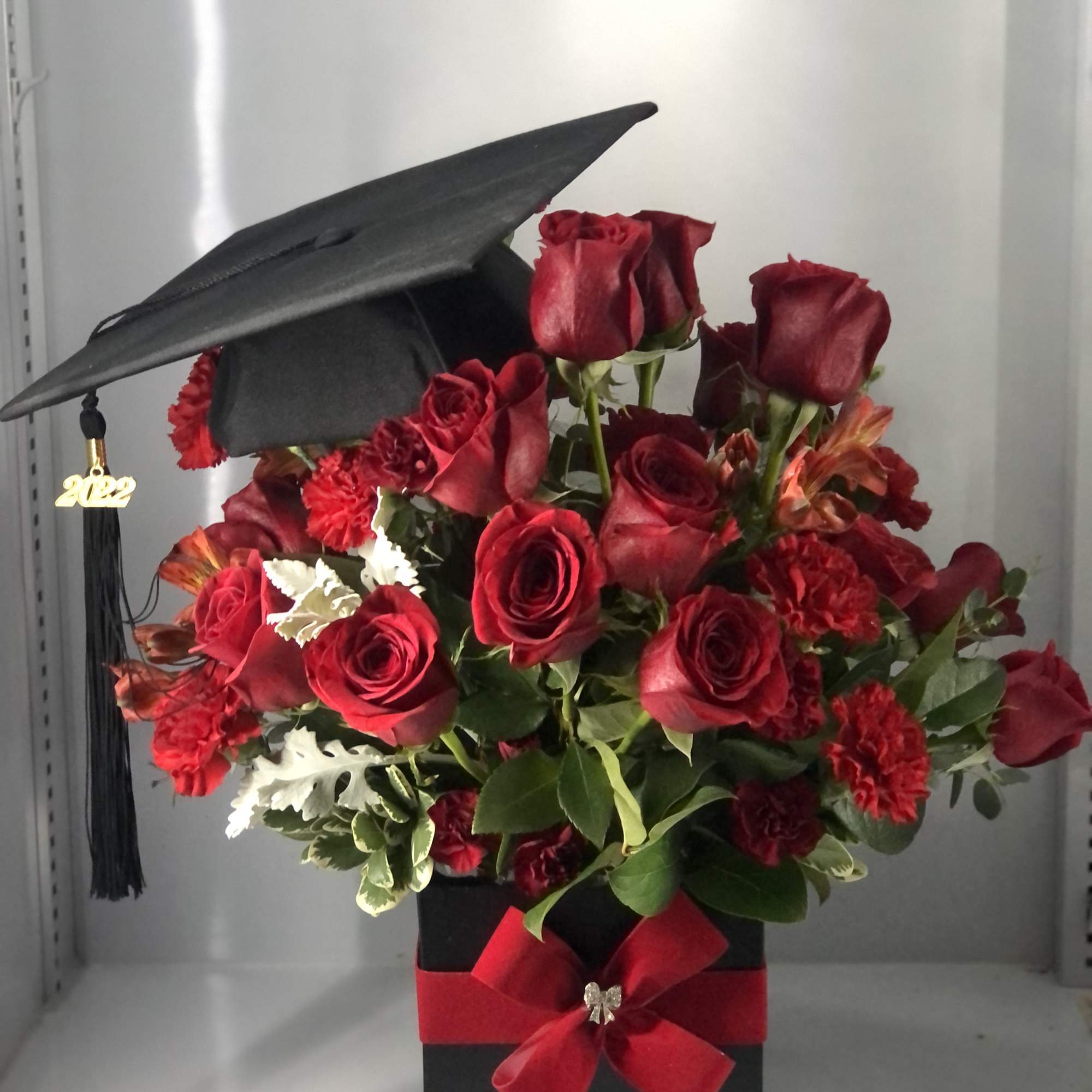 Beautiful Graduation arrangement ,  color can be substituted 