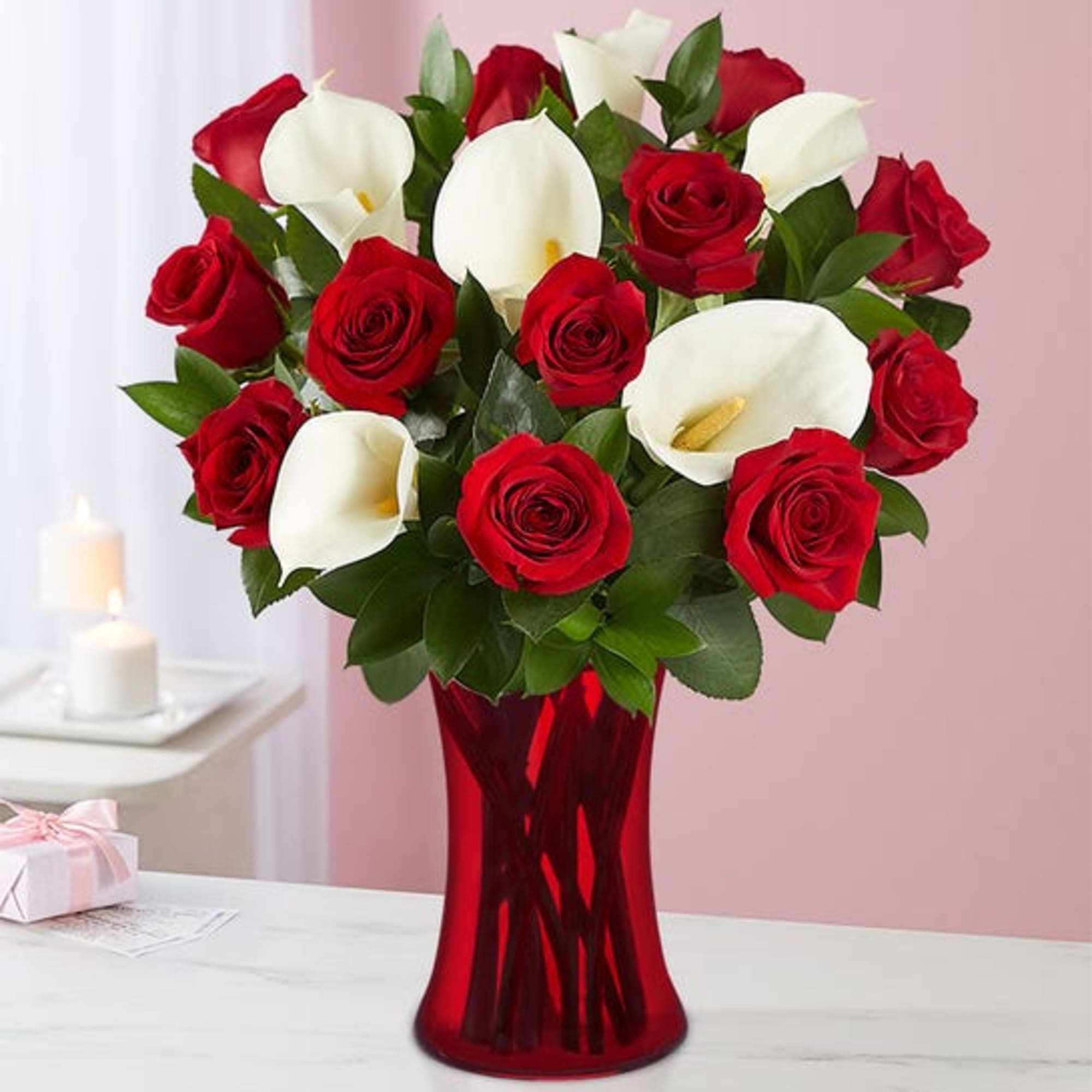 This beautiful hand arranged bouquet comes with roses and calla lilies and
