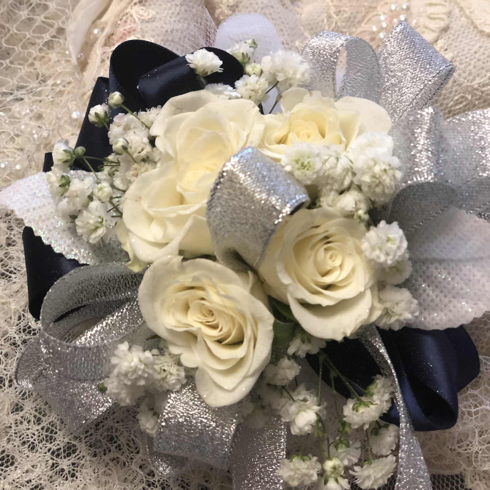 Stand out like royalty with this silver and royal blue wrist corsage Stand out like royalty with this silver and royal blue wrist corsage