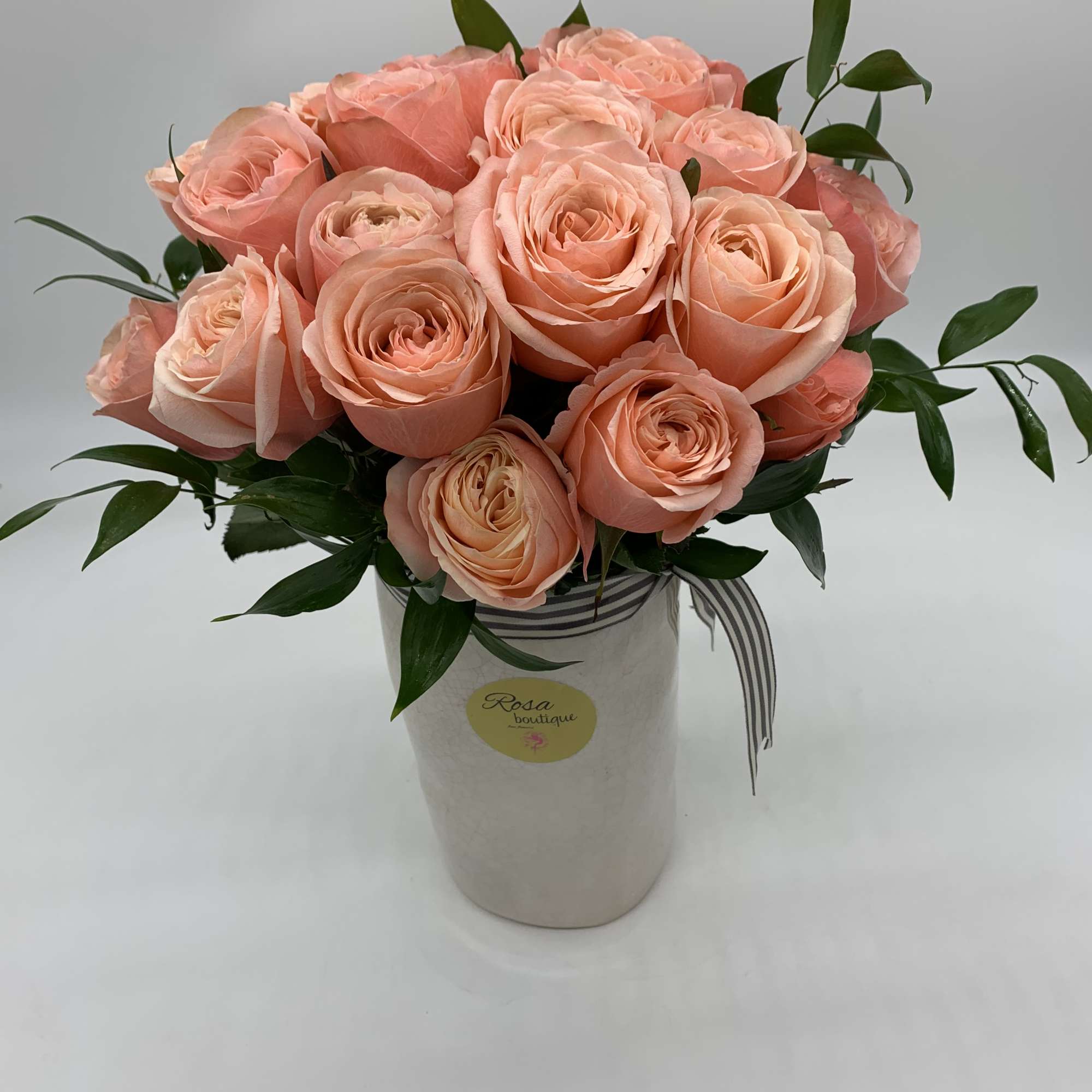 2dozen of peach roses Sitting in a ceramic vase 8&rdquo; fall and