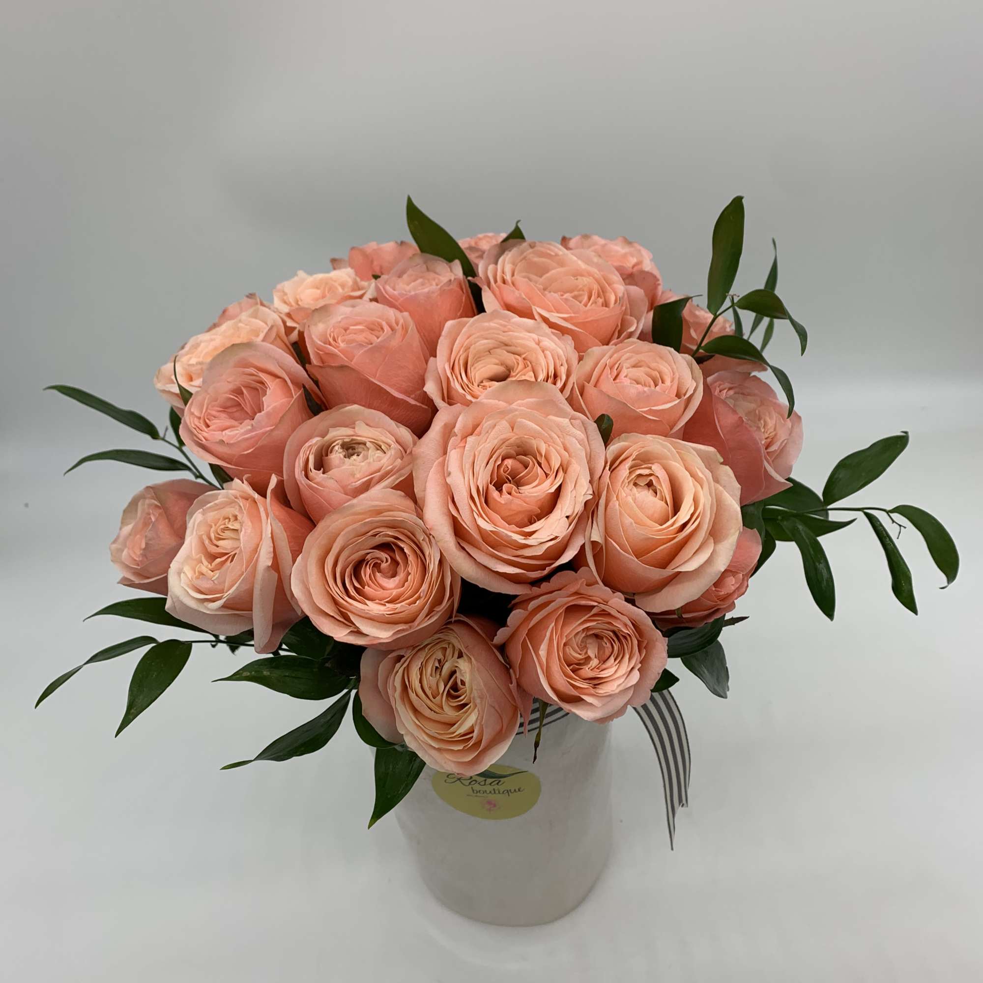 2dozen of peach roses Sitting in a ceramic vase 8&rdquo; fall and