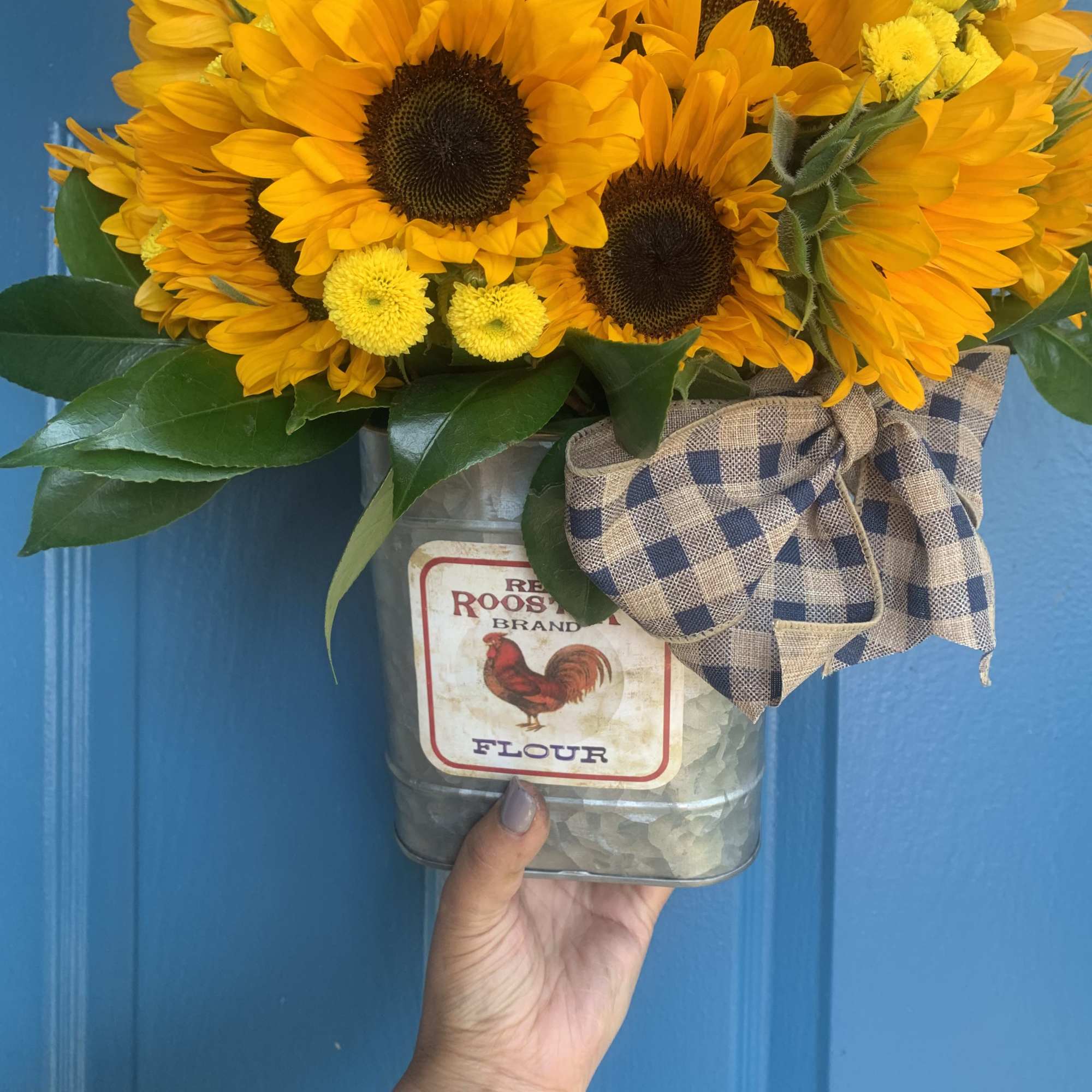 This bright arrangement is made of the portion of 18 sunflower sitting