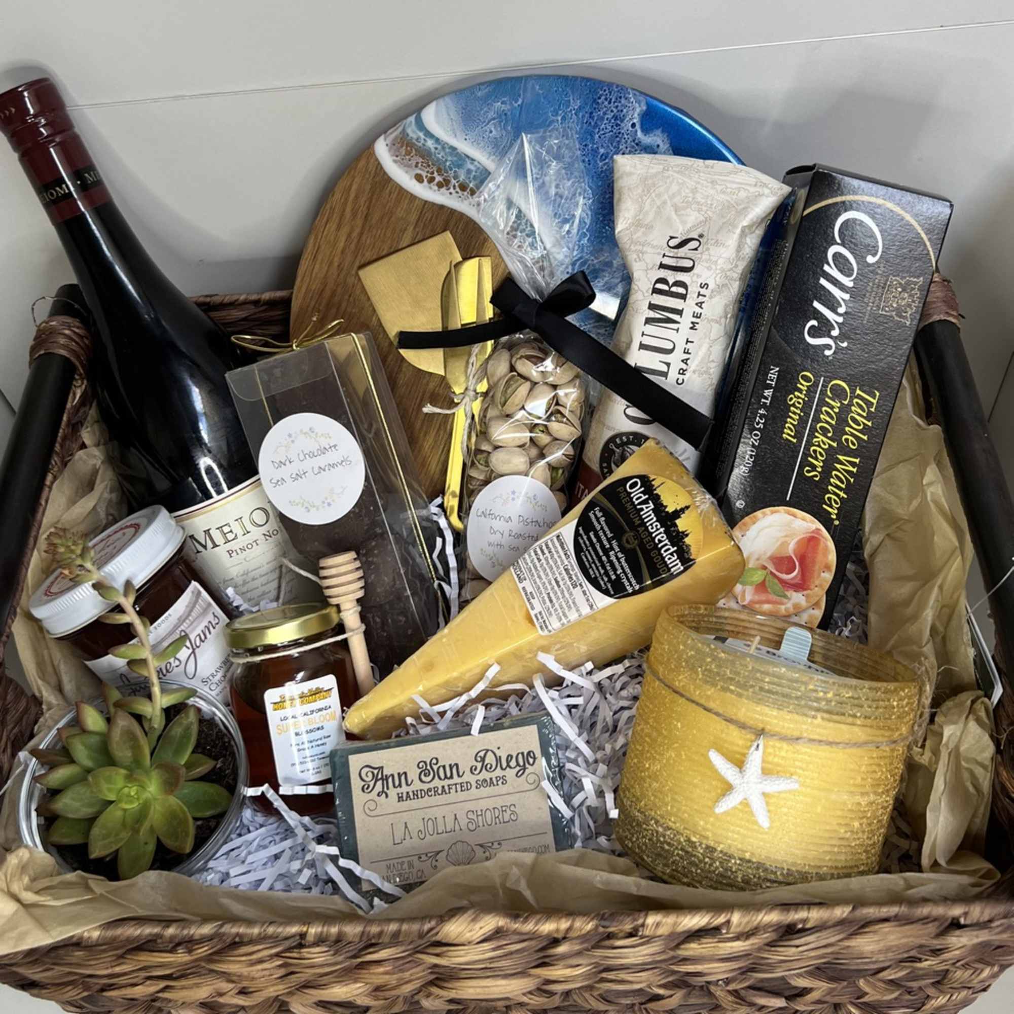 A stunning wine and cheese gift basket, with a coastal theme. This