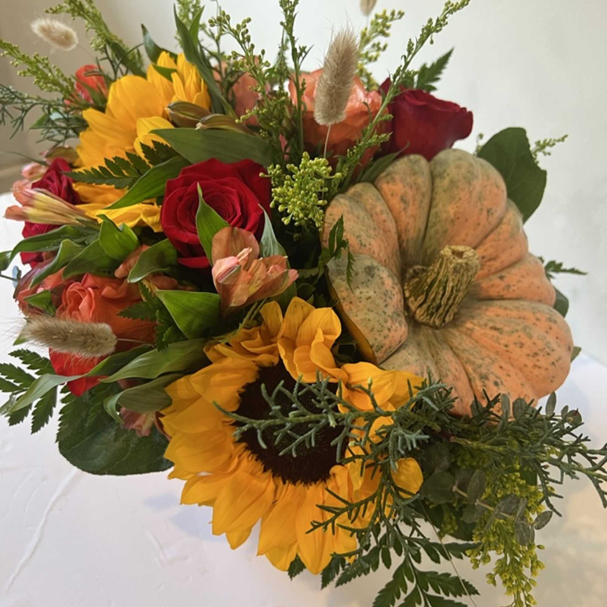 Our real pumpkin holds a garden of fresh and fragrant evergreens. Autumn-inspired