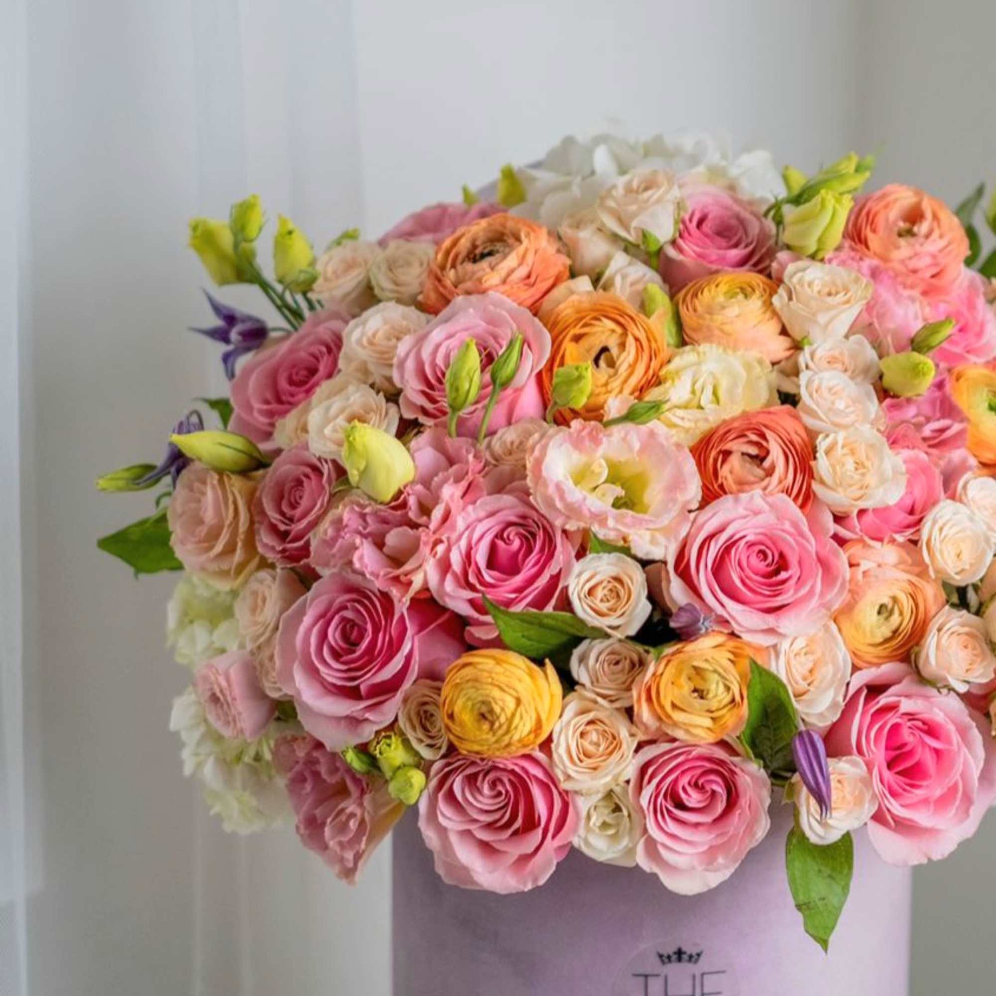 This is a gentle arrangement in warm shades of peach palette. It