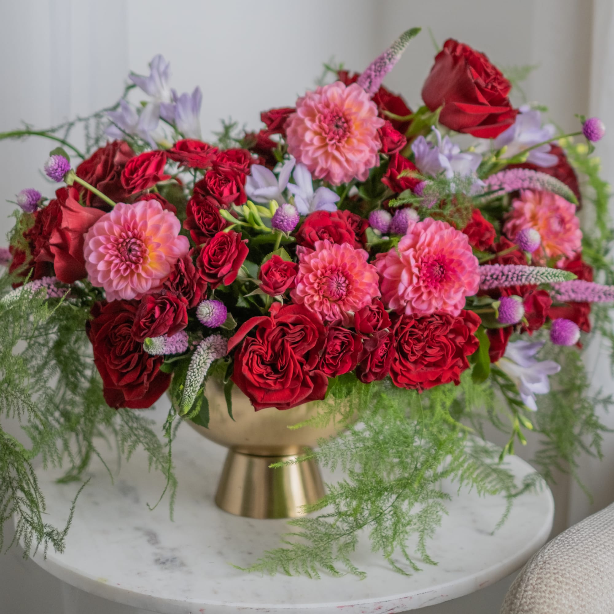 An arrangement in burgundy and saturated shades stands out for its depth