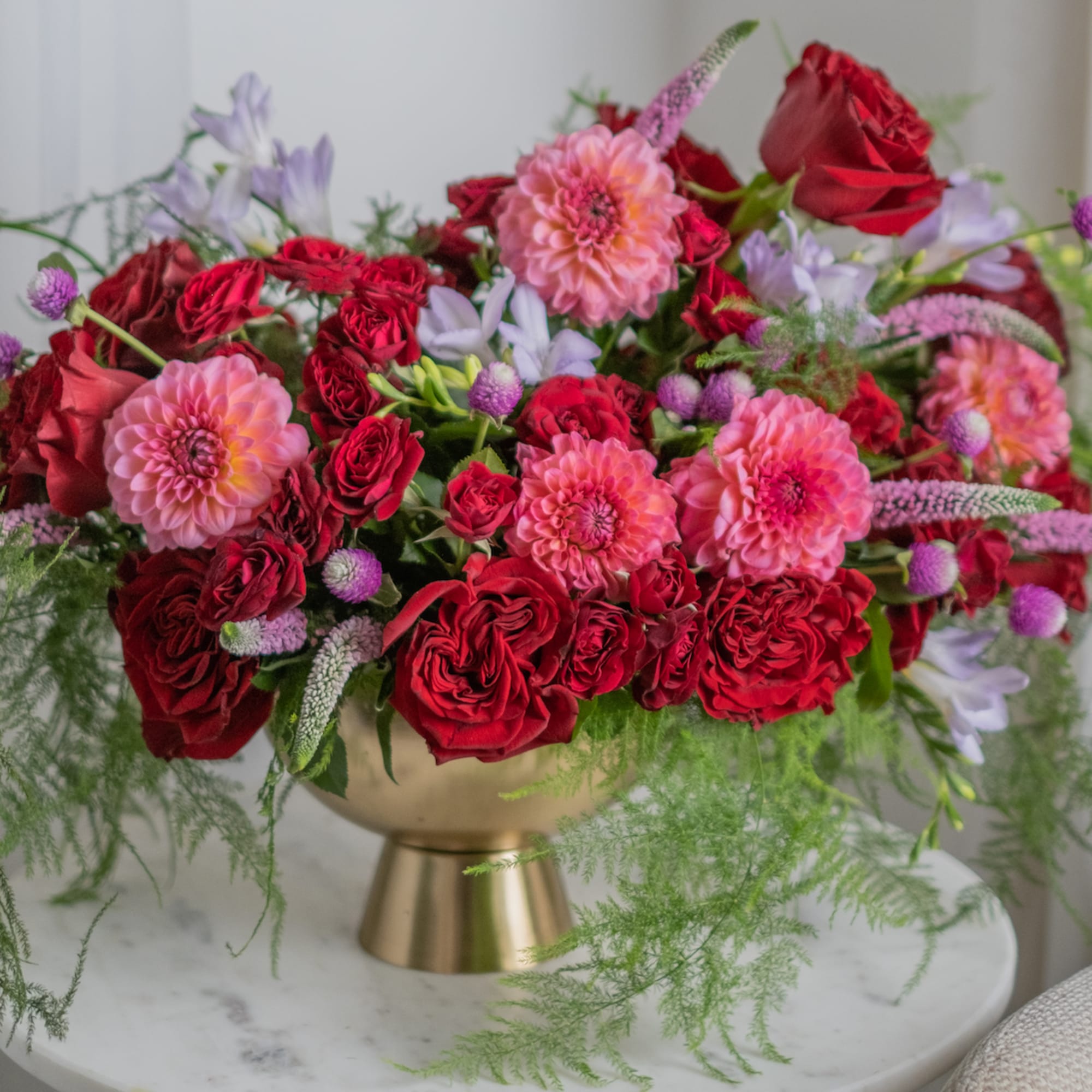 An arrangement in burgundy and saturated shades stands out for its depth