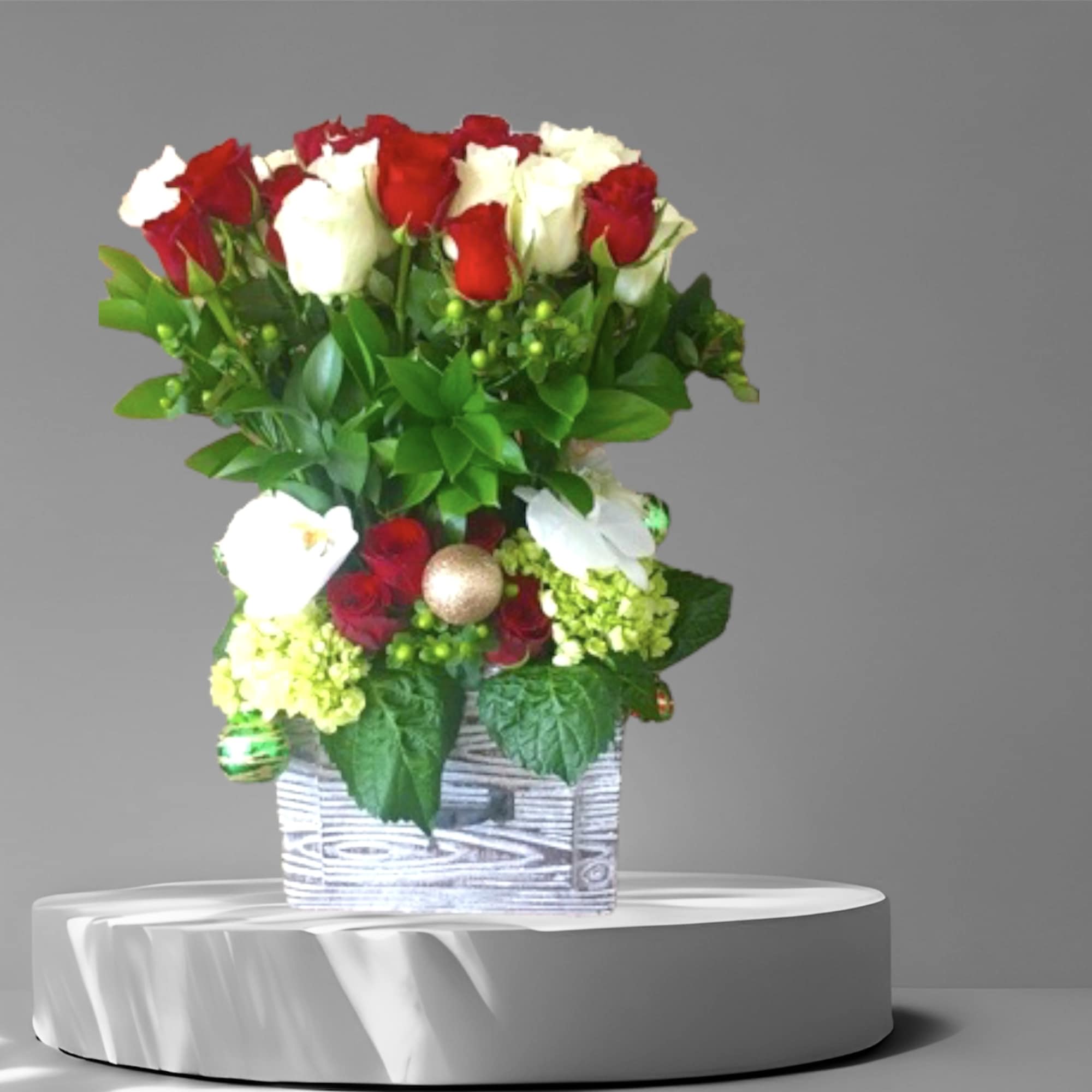 A large arrangement of 4 dozen red and white roses with mini