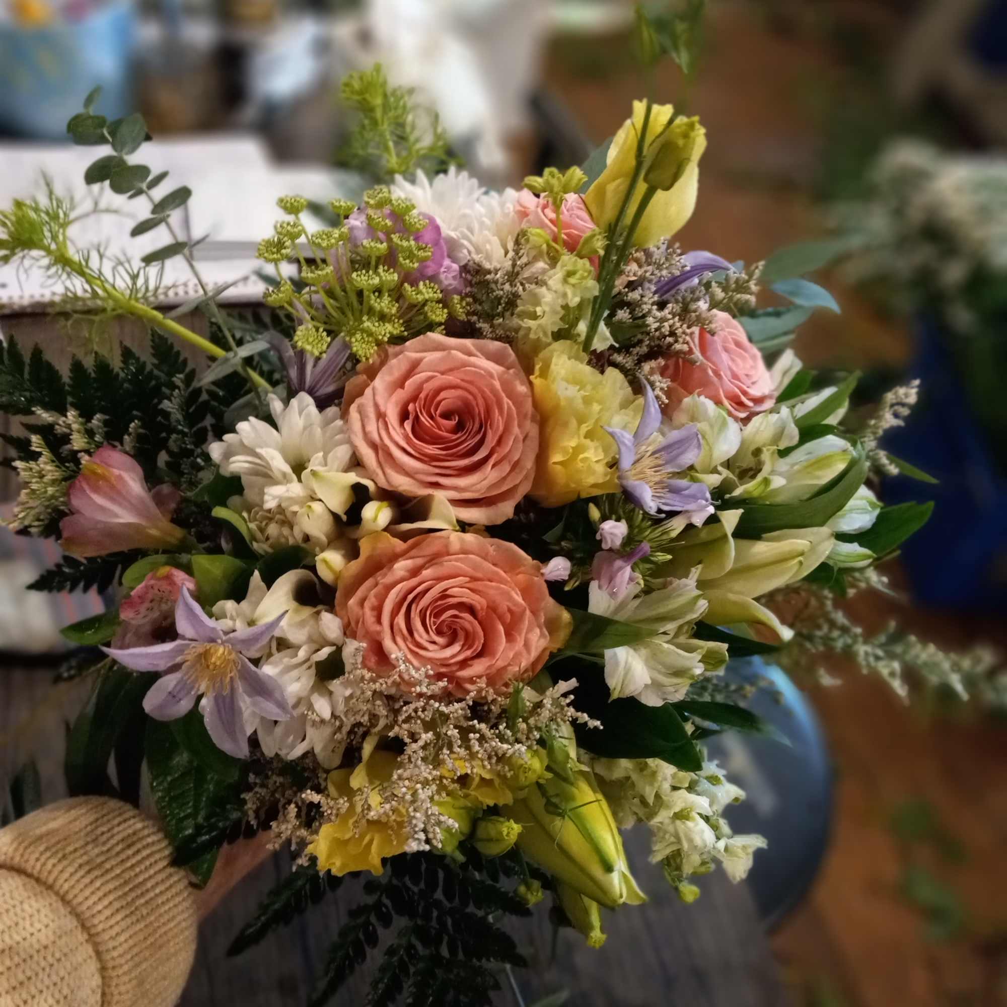 As happy as the bride's cascade bouquet, Melissa's wedding bridesmaids' bouquets are