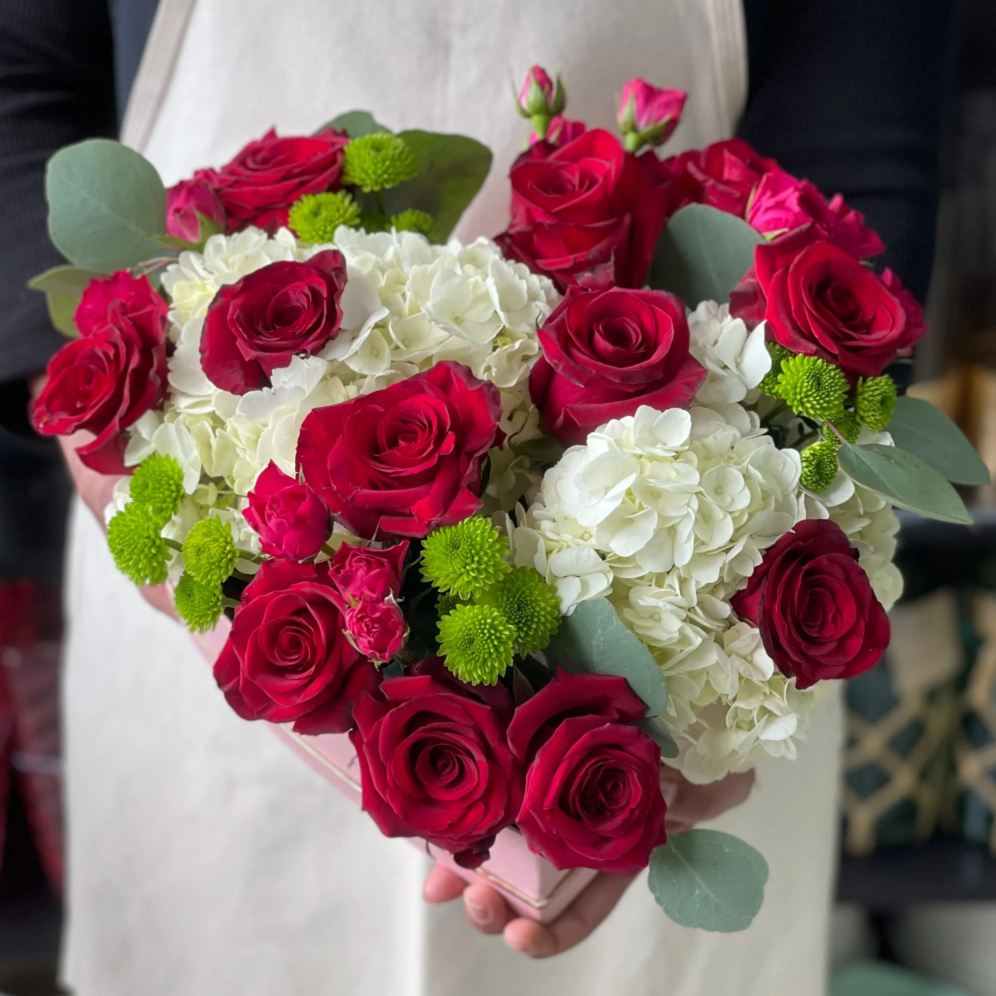 Beautiful heart pink box with mix of roses, spray roses, hydrangea and
