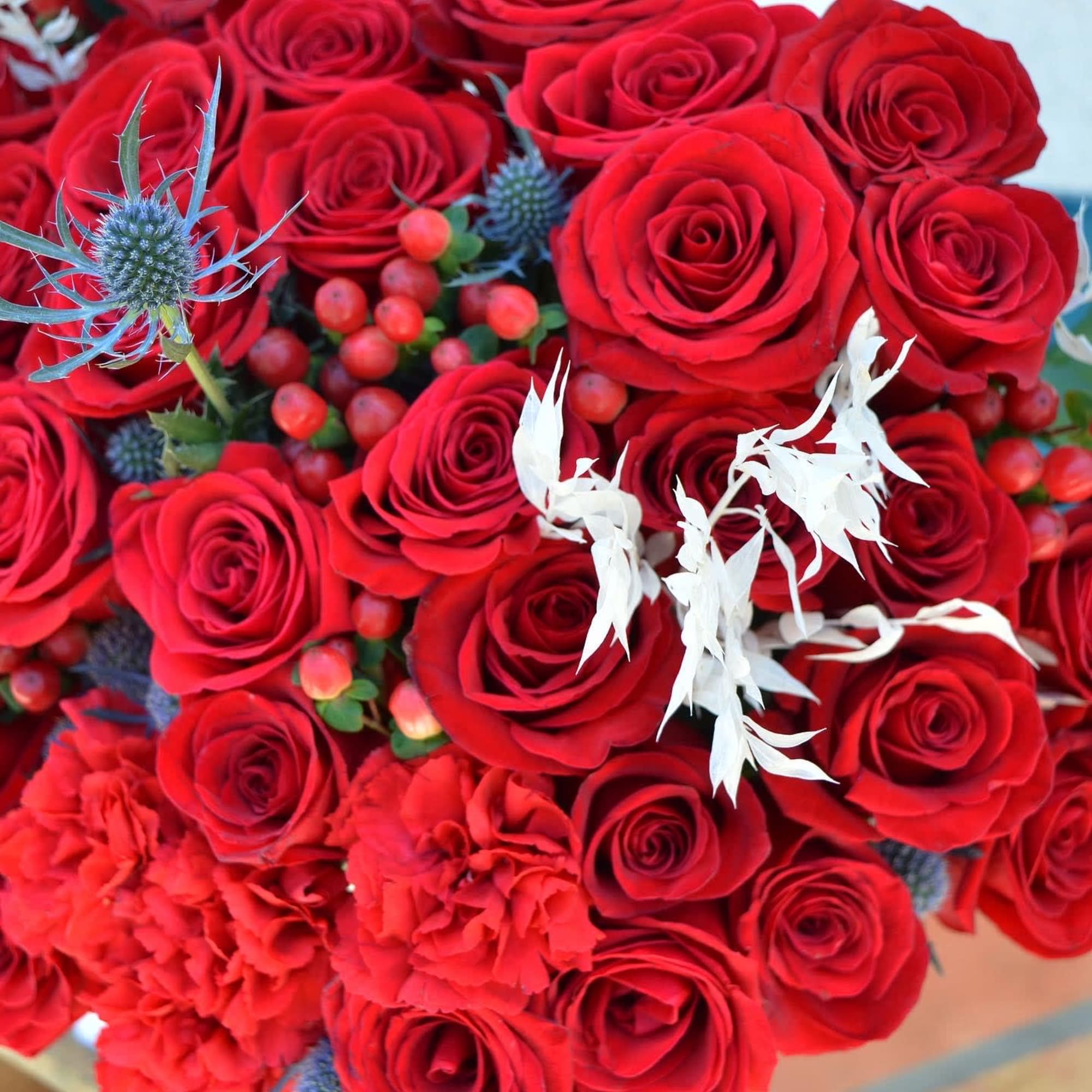 A luxury flowers box made mainly from red roses and some other